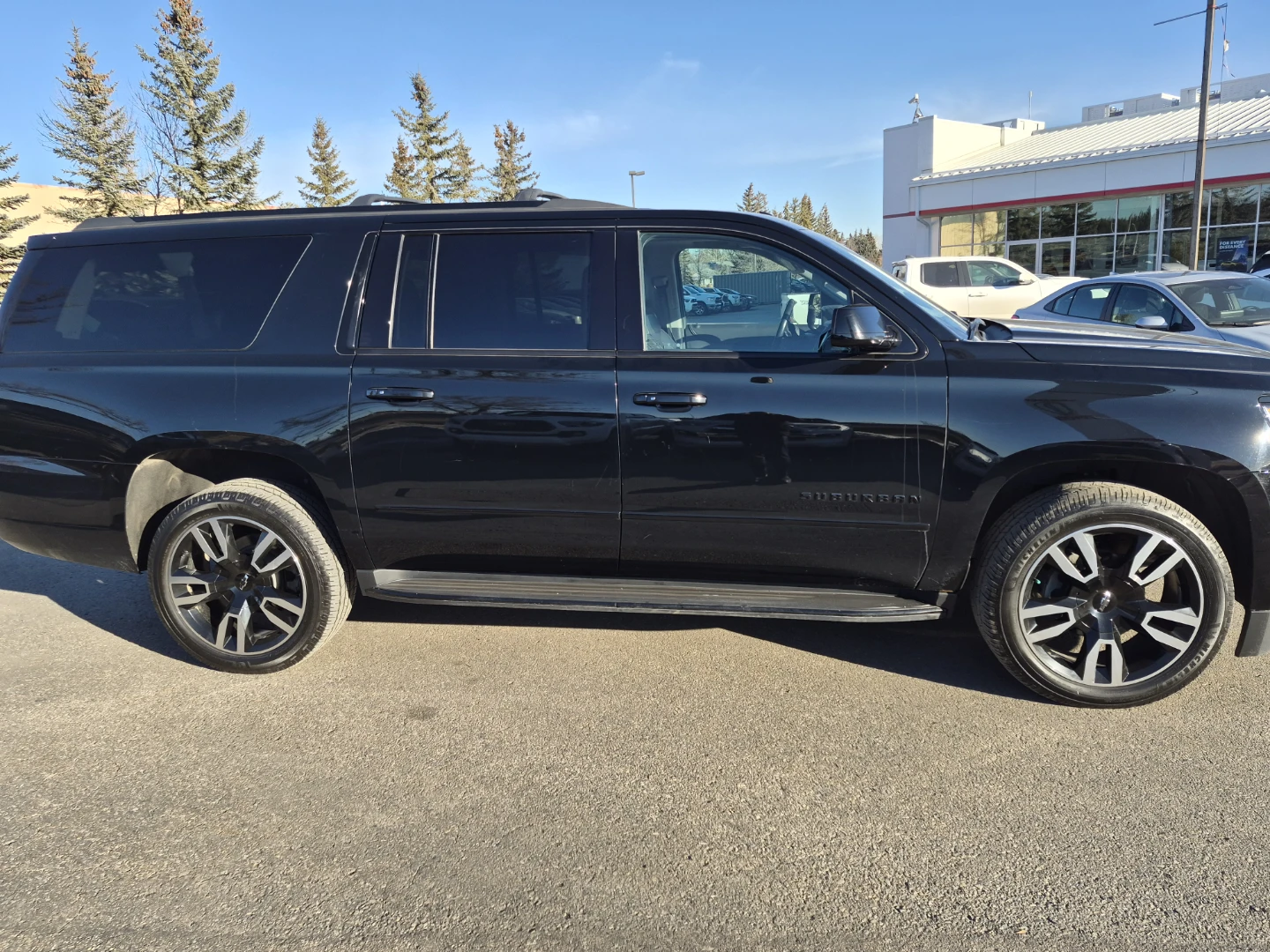 Black Chevrolet Suburban SUV - photo 3