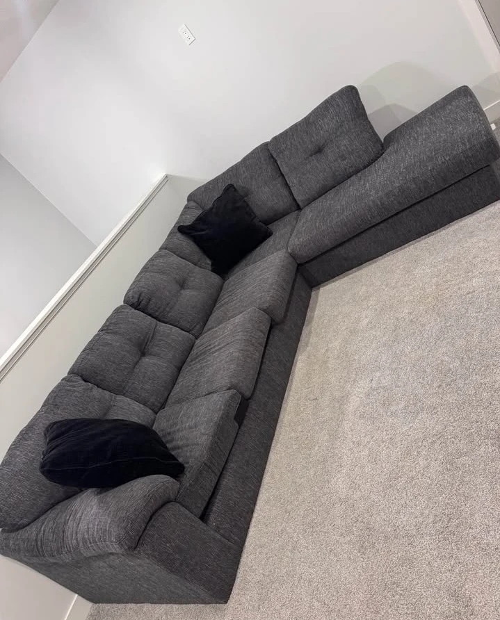 Grey Sectional Sofa with Black Pillows