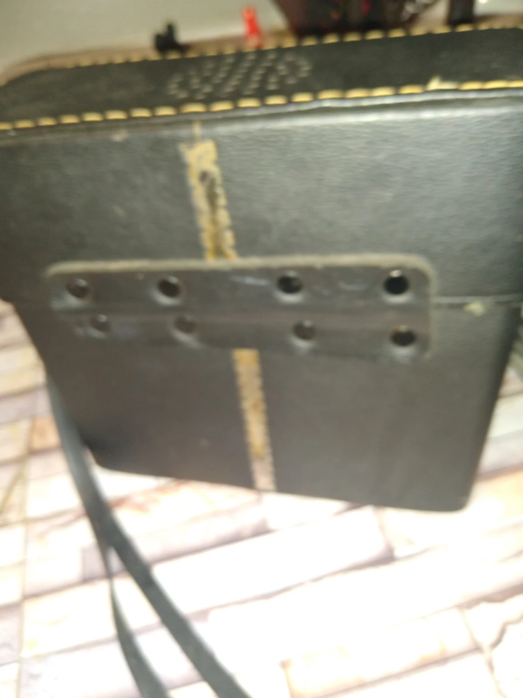 Antique leather binocular case with amfm radio in it