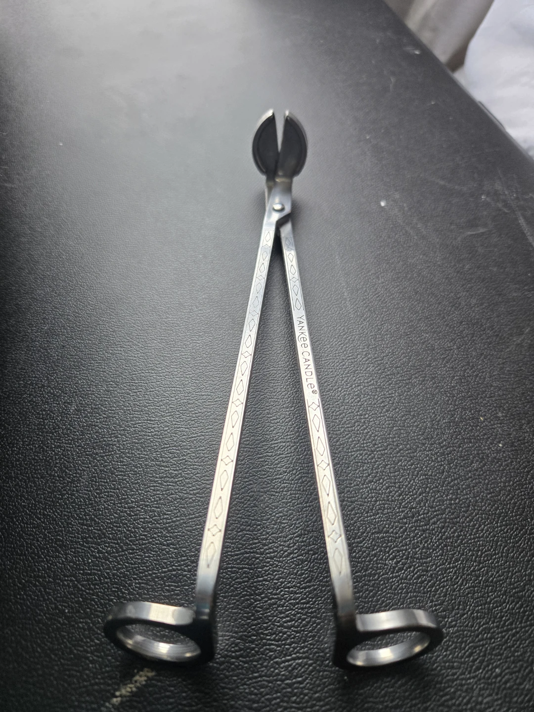 Unique candle wick cutter