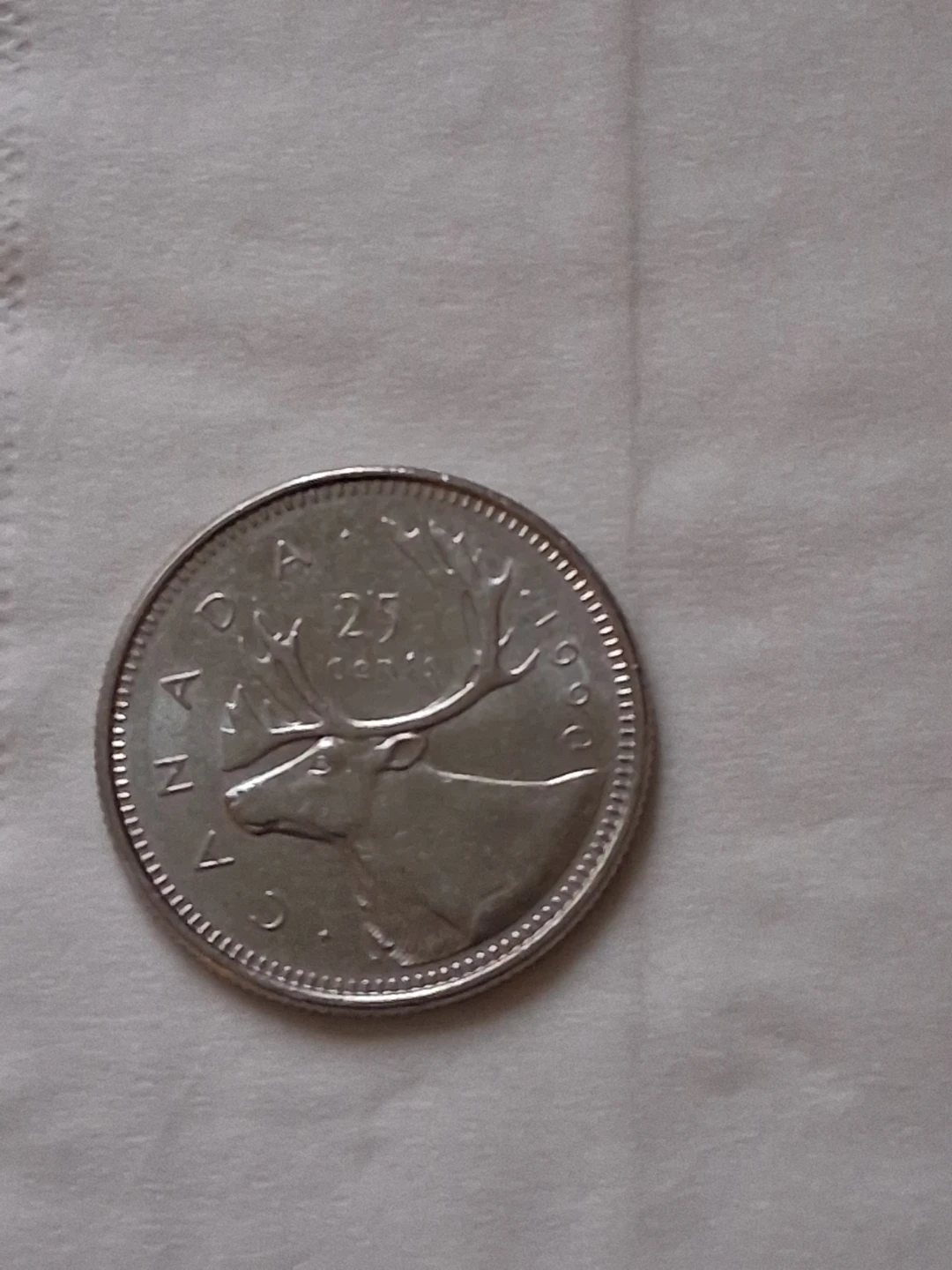 1990 Canadian 25 cents coin