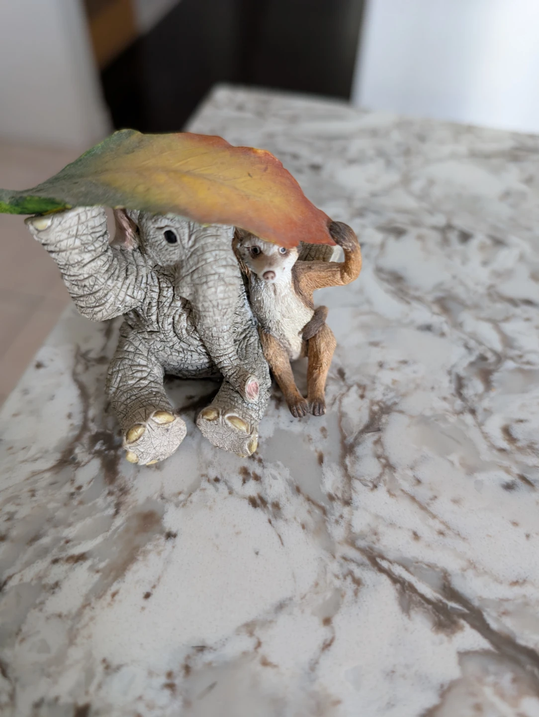 Elephant and Meerkat Figurine with Leaf Umbrella