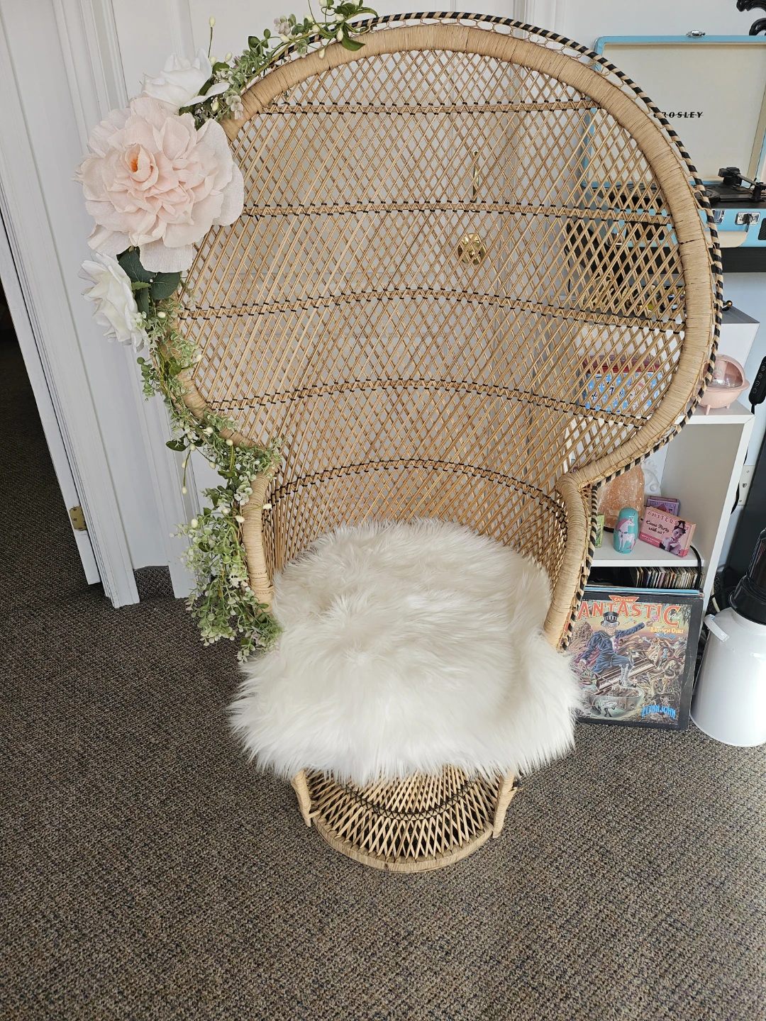 Wicker Peacock Chair with Faux Floral Garland