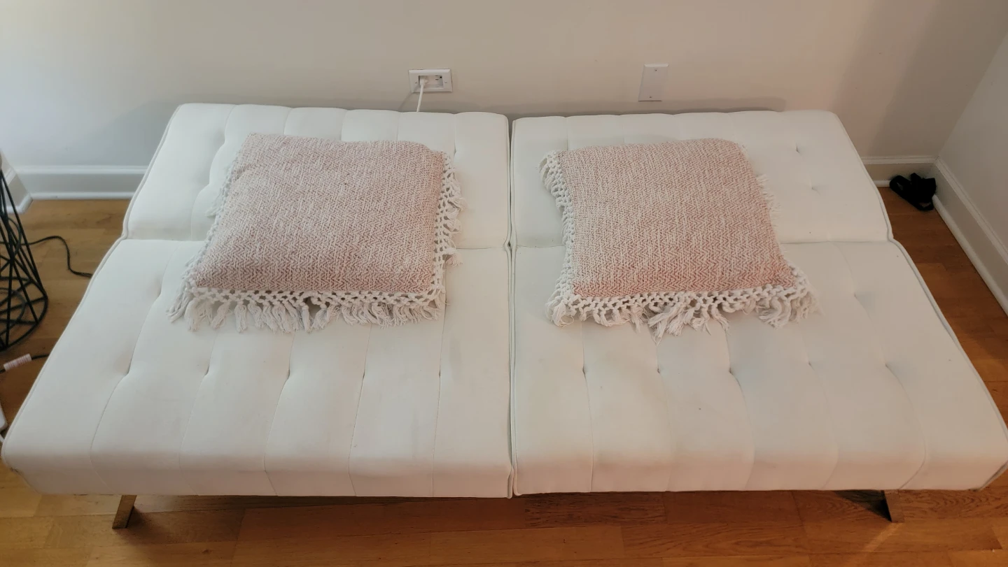 Convertible White Futon Sofa with Pink Pillows - photo 3