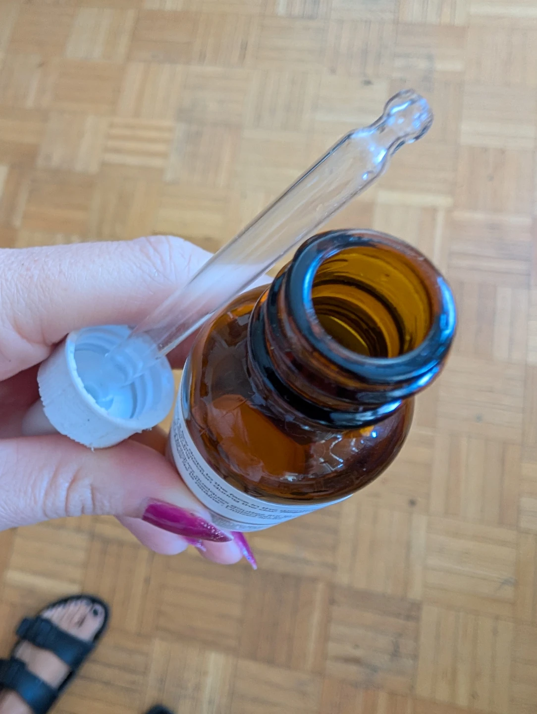 Empty amber colored bottle with dropper