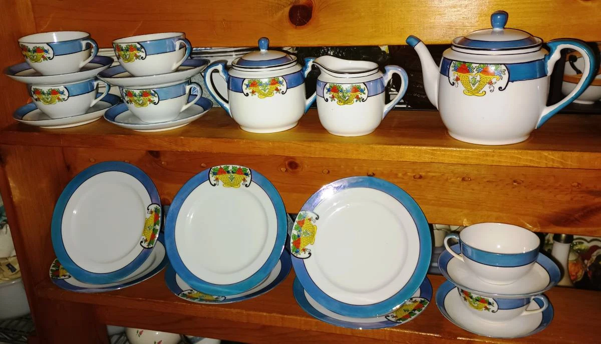 Vintage Teacup and Saucer Set with Creamer, Sugar, and Teapot