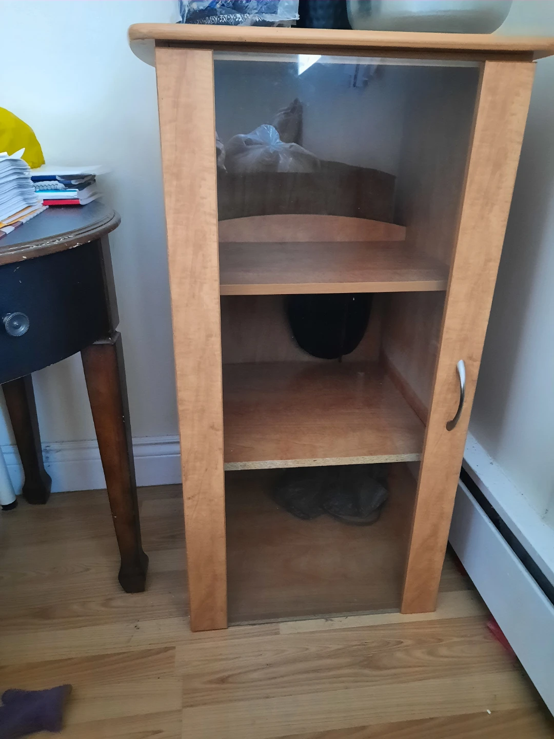 Wooden display cabinet with glass door