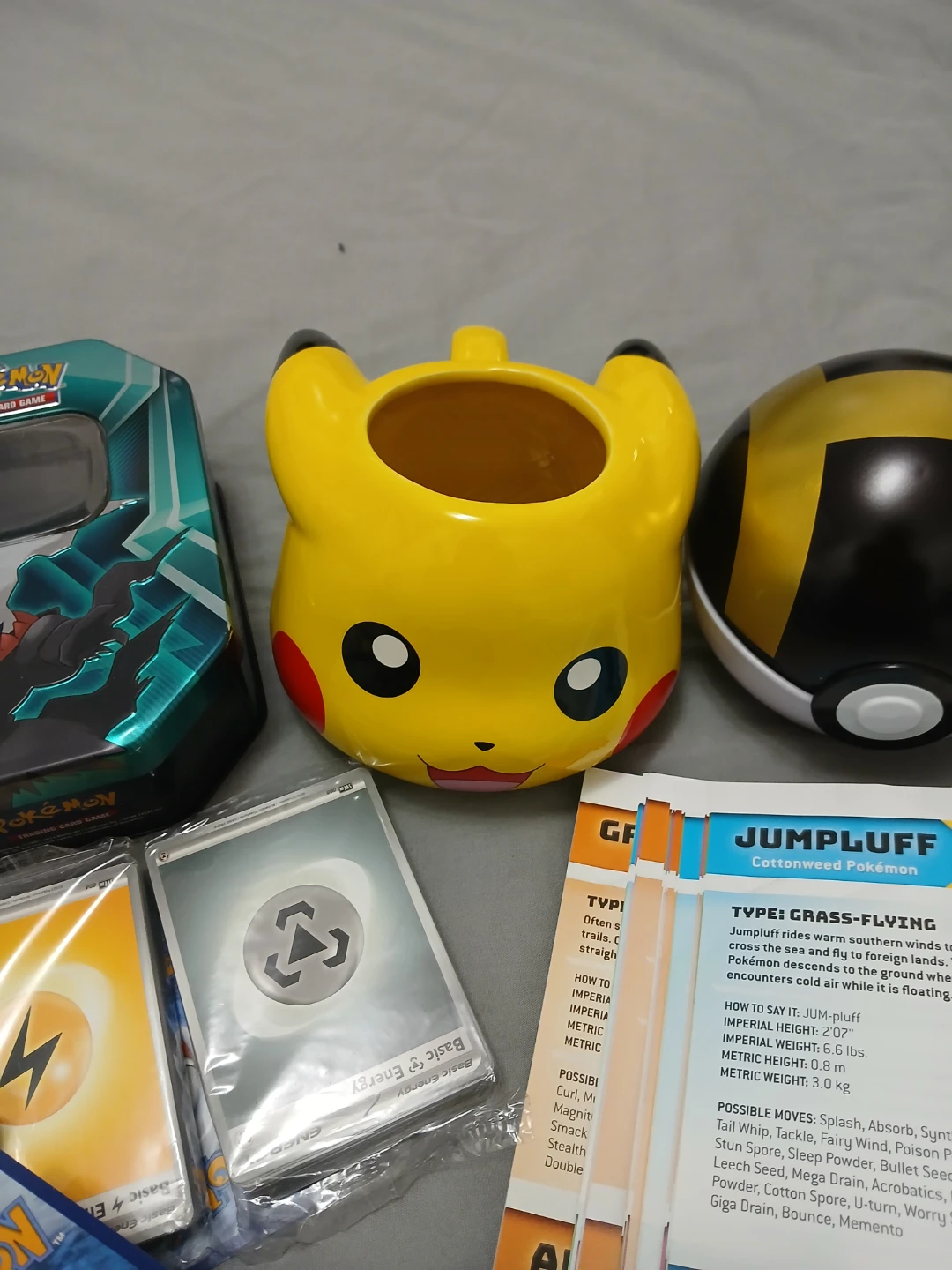 Pokémon Cards, Tin, Pikachu Pot, & Guidebook Bundle - photo 2