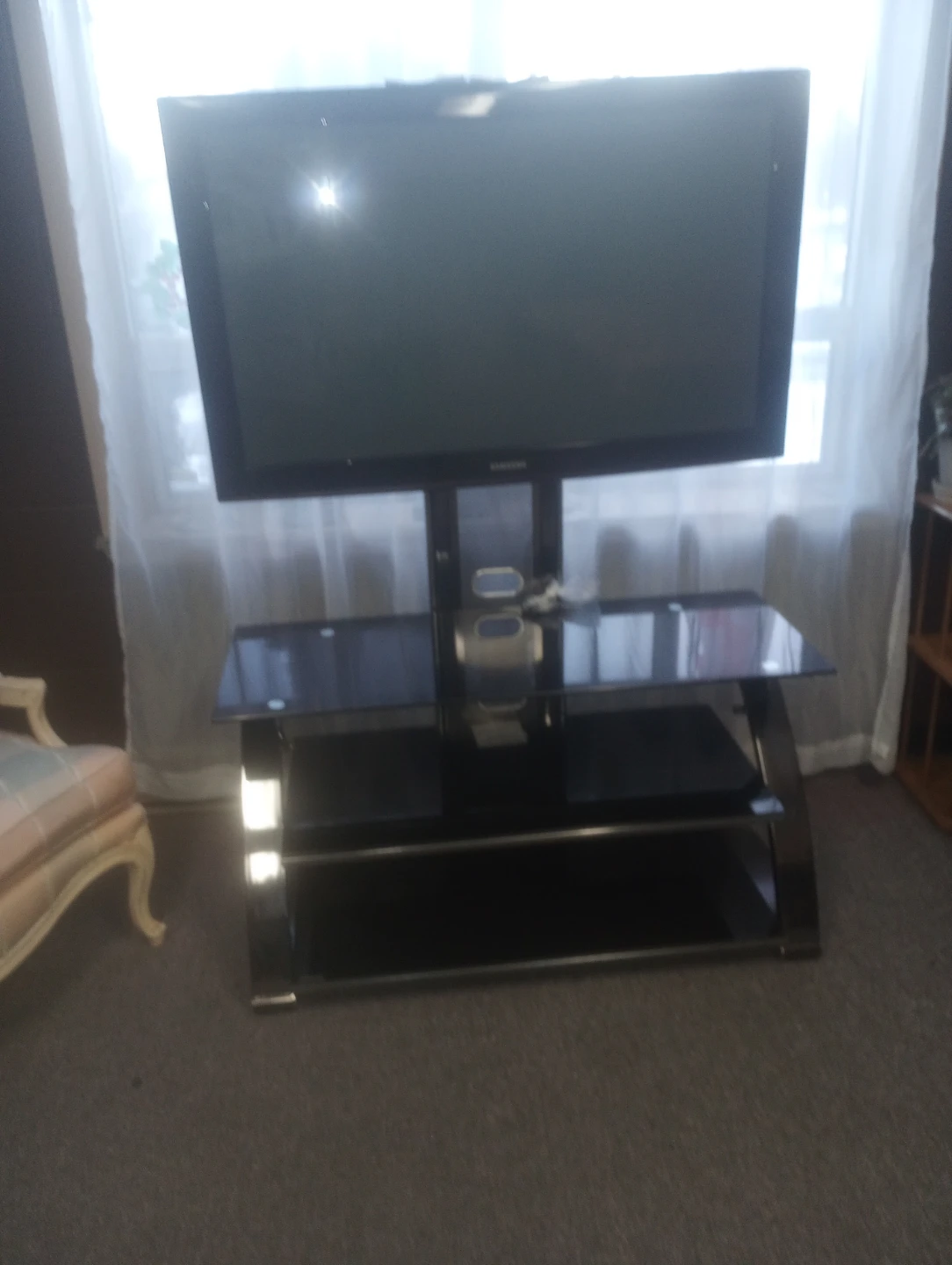 Black Glass TV Stand with smart tv $450 or offer