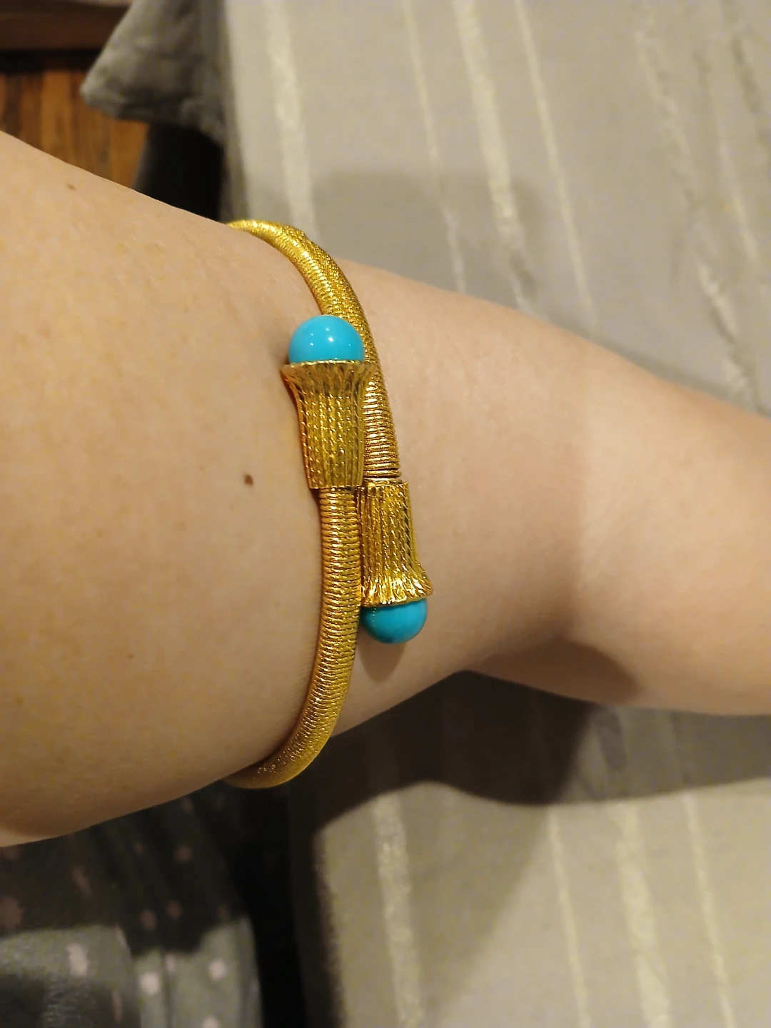 Gold Tone Bangle Bracelet with Blue Accents