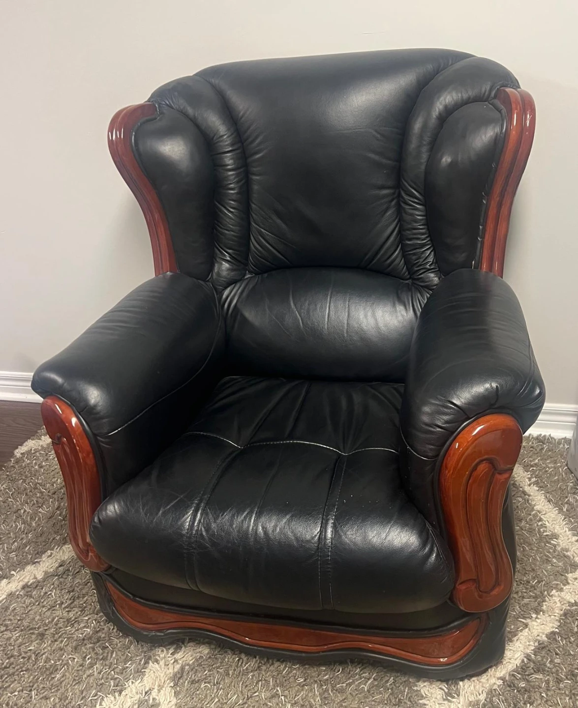 Black Leather Armchair with Wooden Accents