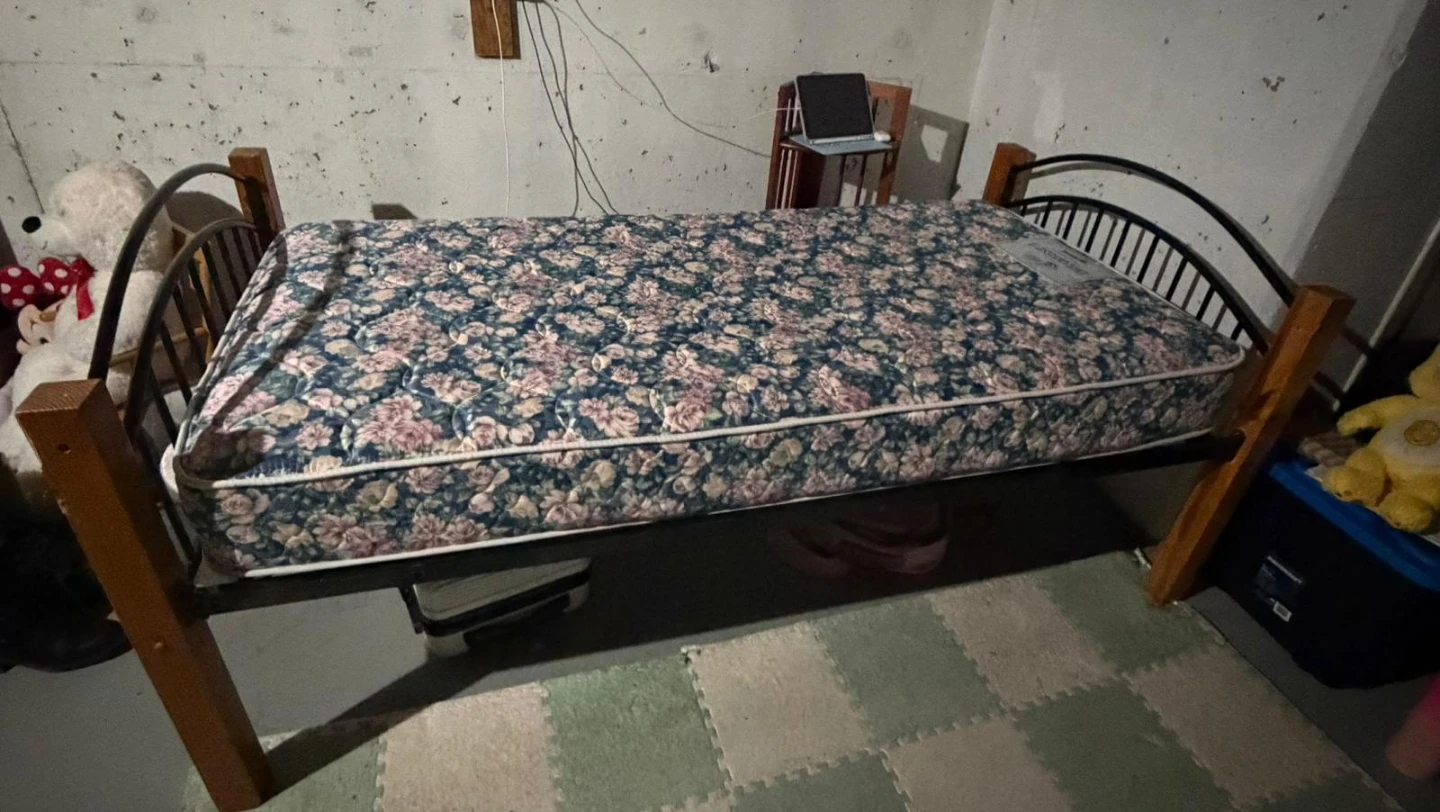 Twin-size bed frame with mattress