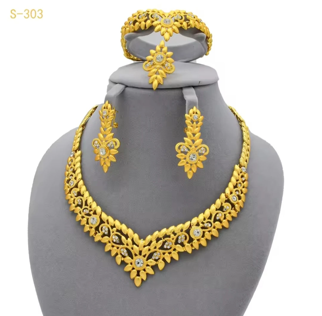 Gold coloured jewellery set with rhinestones
