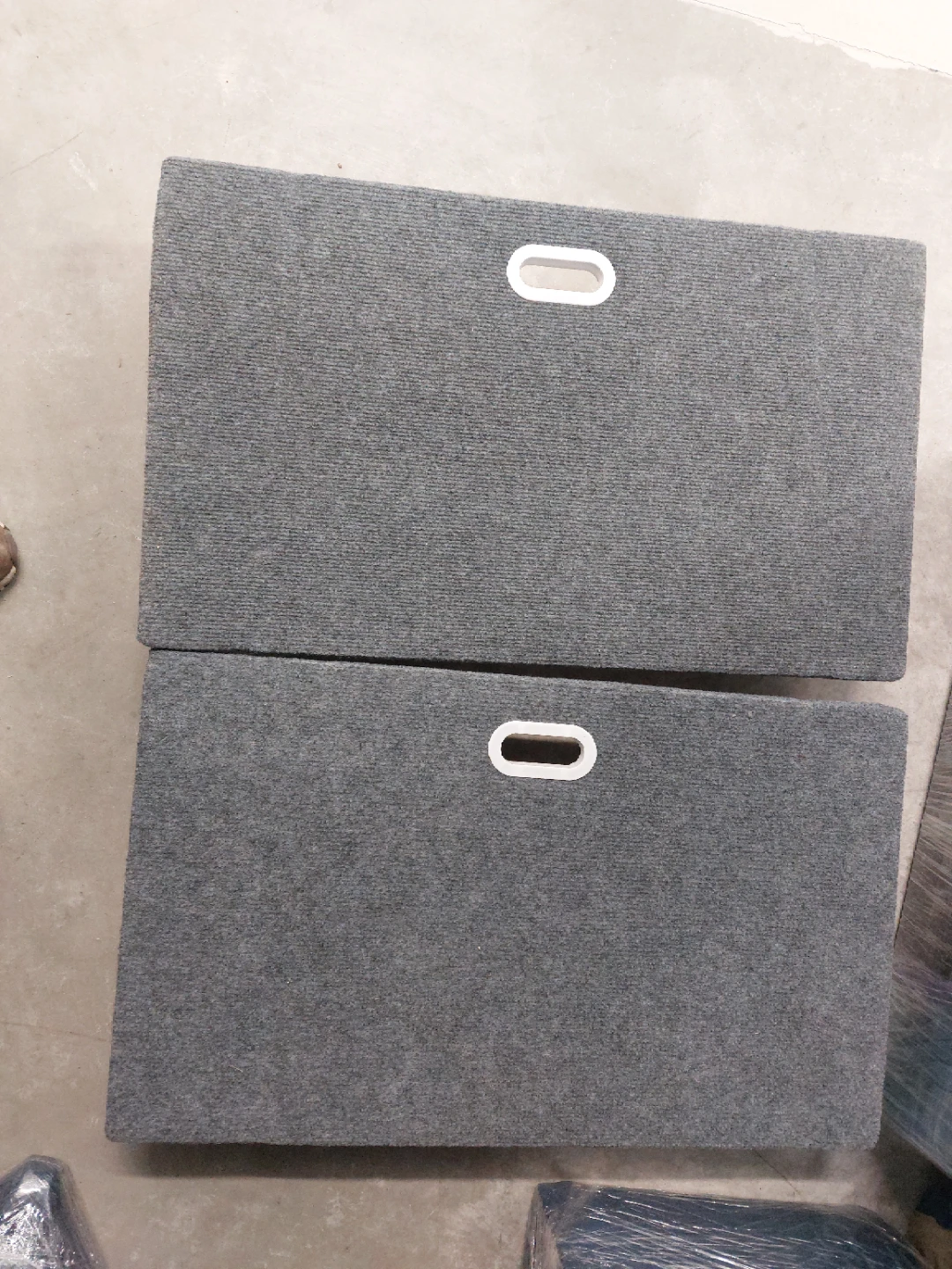 Two carpeted moving dollies