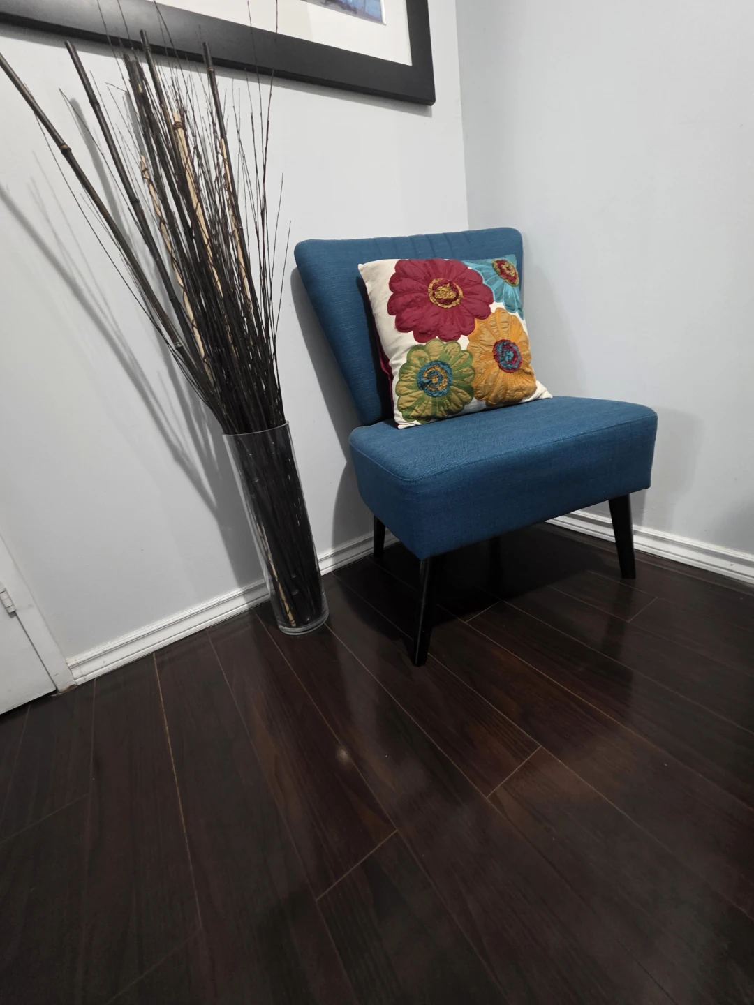 Blue accent chair with decorative pillow