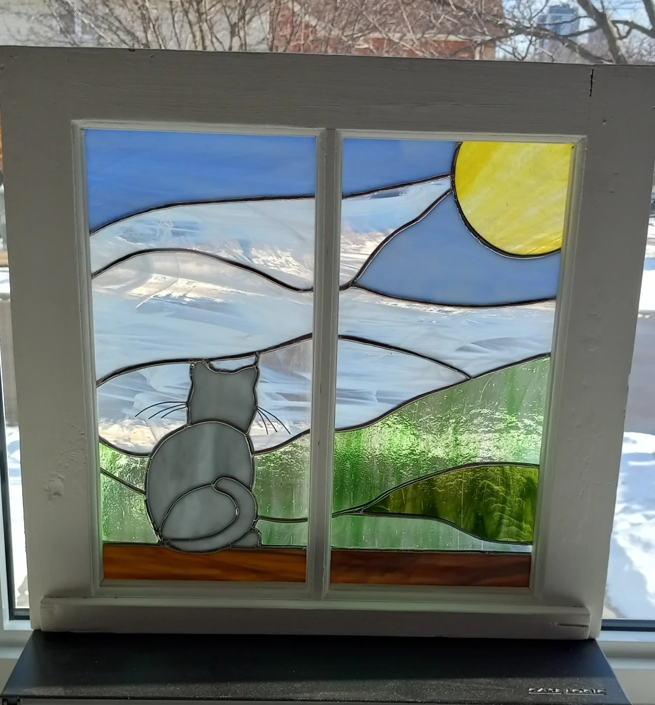 Stained glass scene with cat