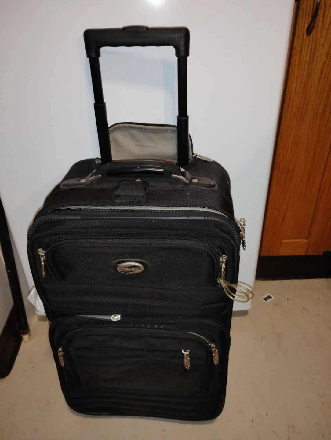 American Tourister Black Rolling Suitcase