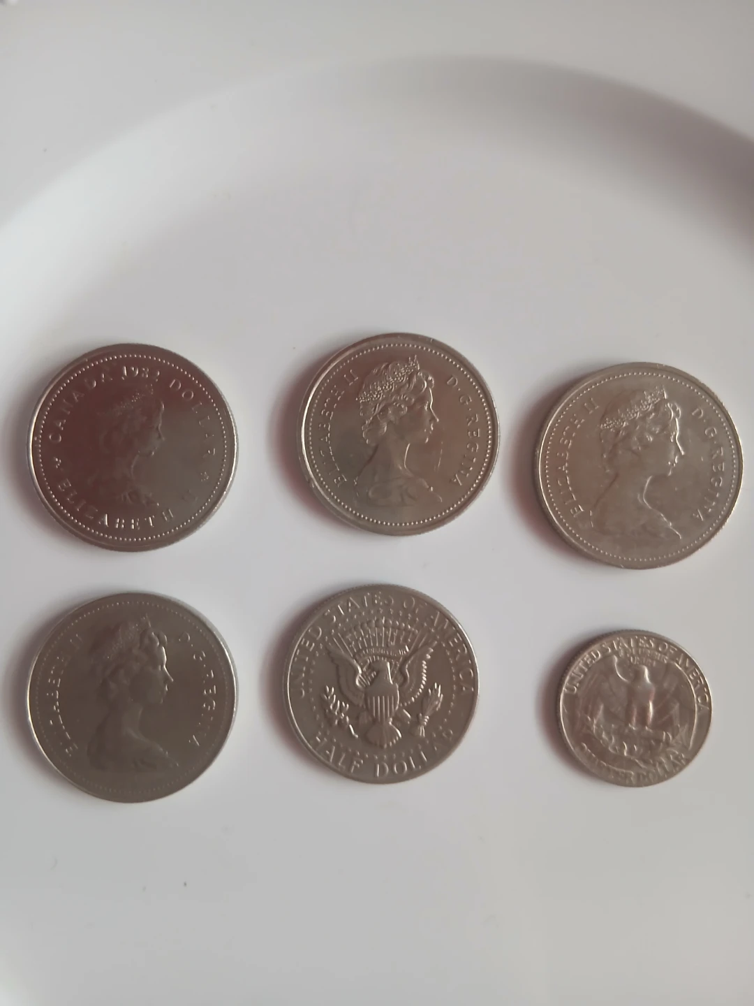 Euro,Italian Coin, Canadian Dollars, and US Half Dollar. Etc.