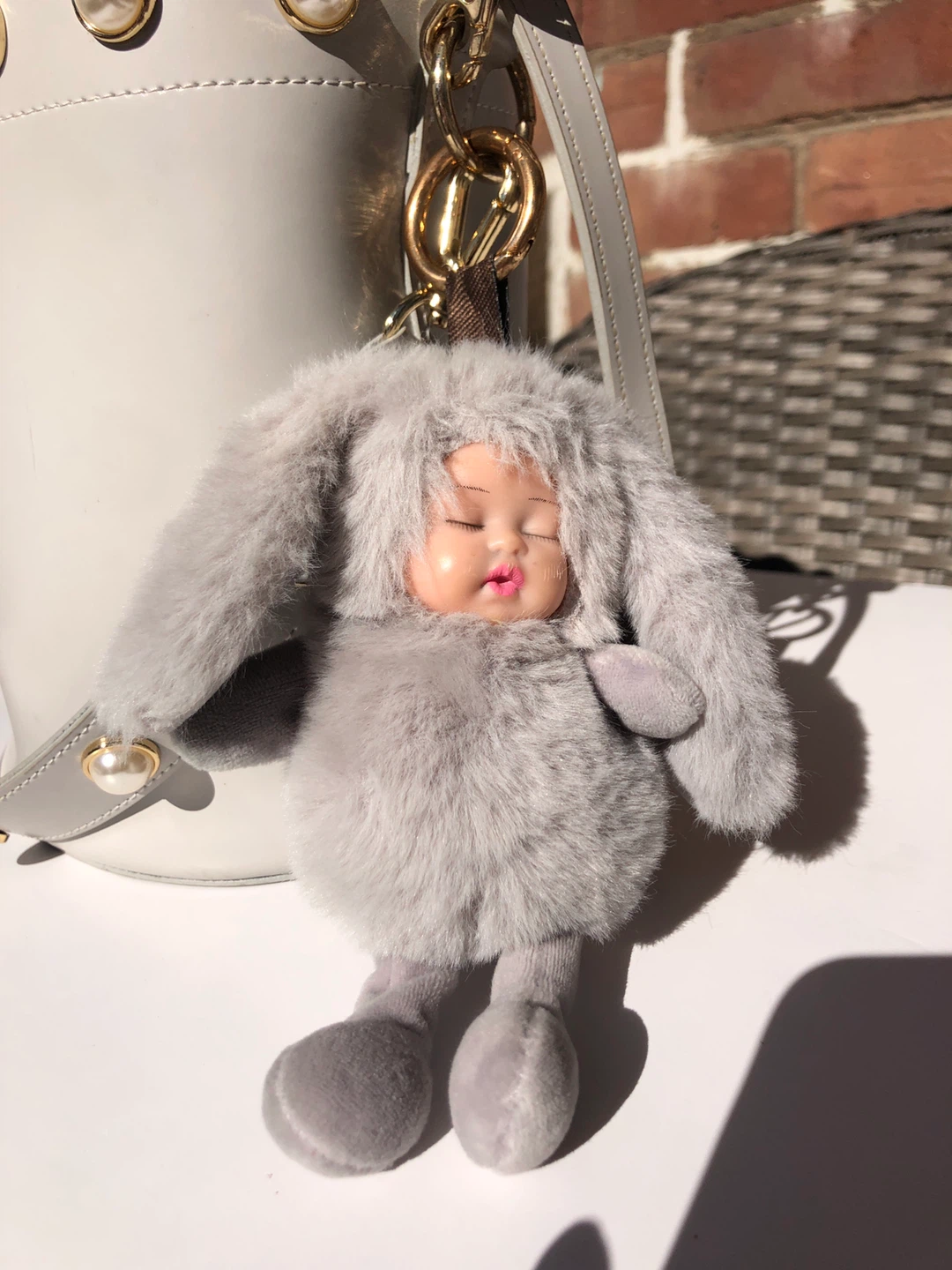 Grey bucket bag with pearl details and fuzzy charm - photo 3