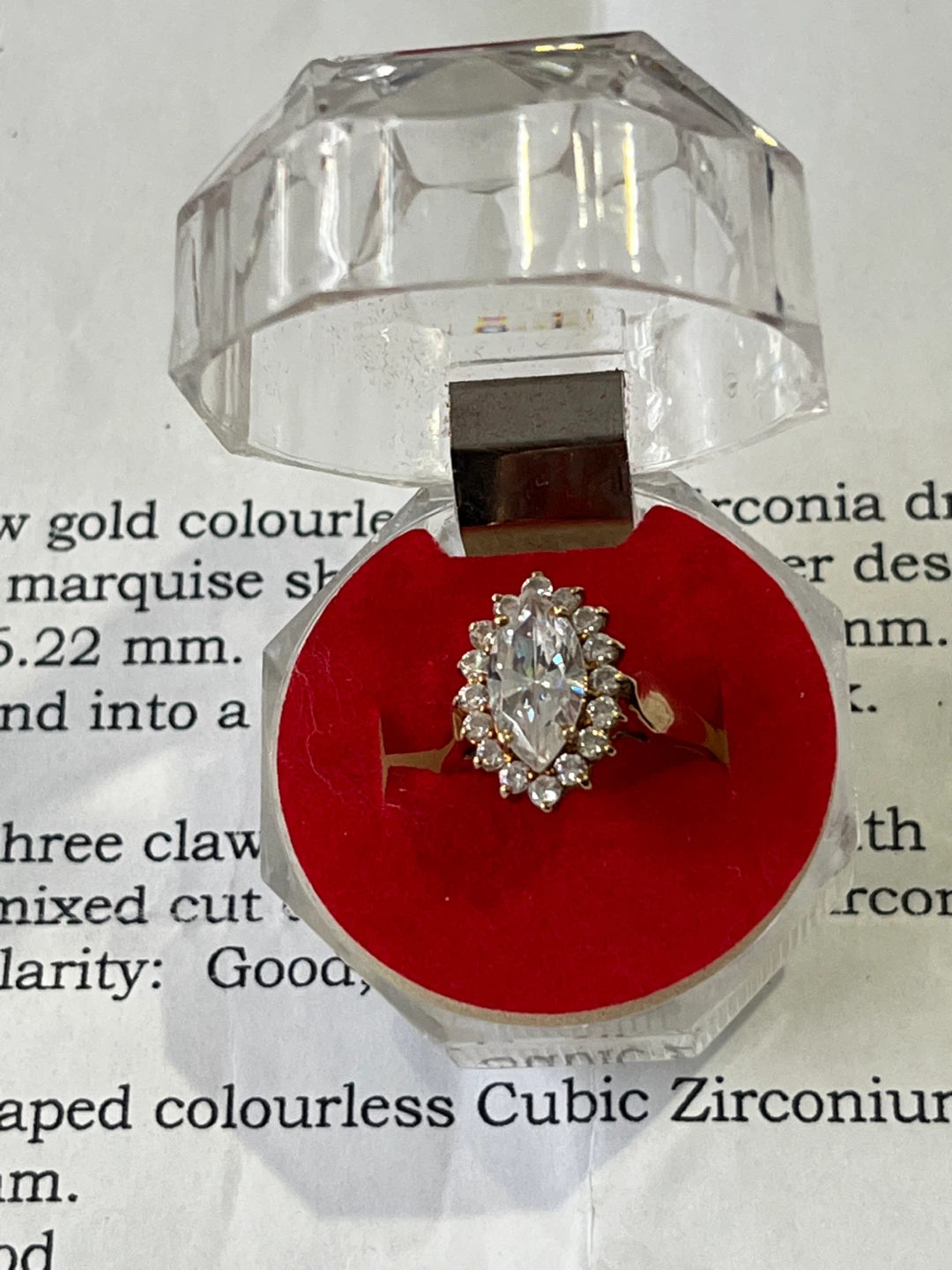 Gold coloured ring with marquise shaped Cubic Zirconium