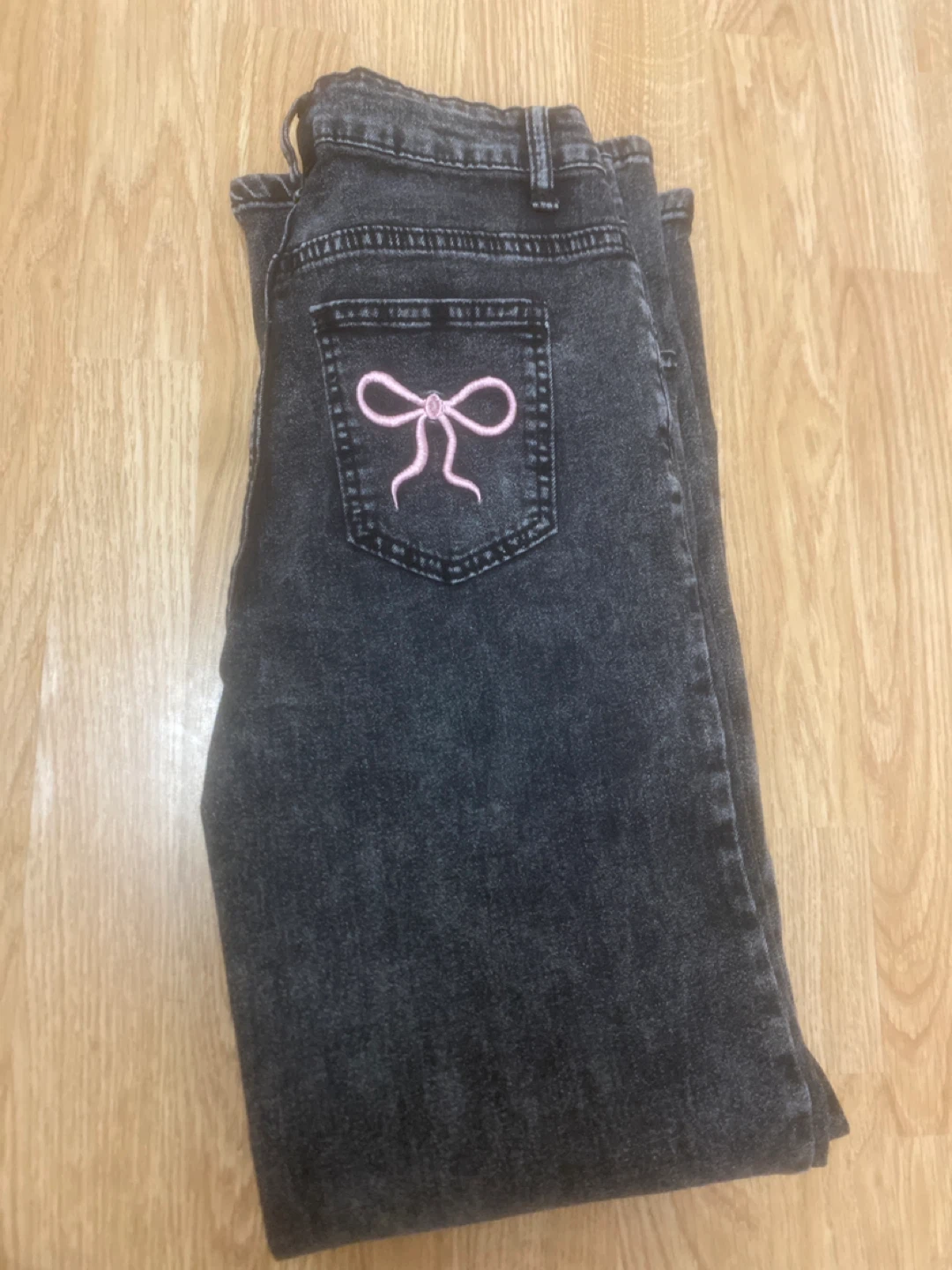 Women's Acid Wash Wide Leg Jeans with Pink Bow Detail