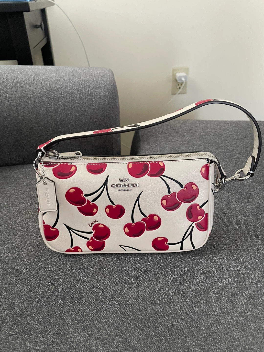 Coach nolita 19 with cherry print handbag/purse.