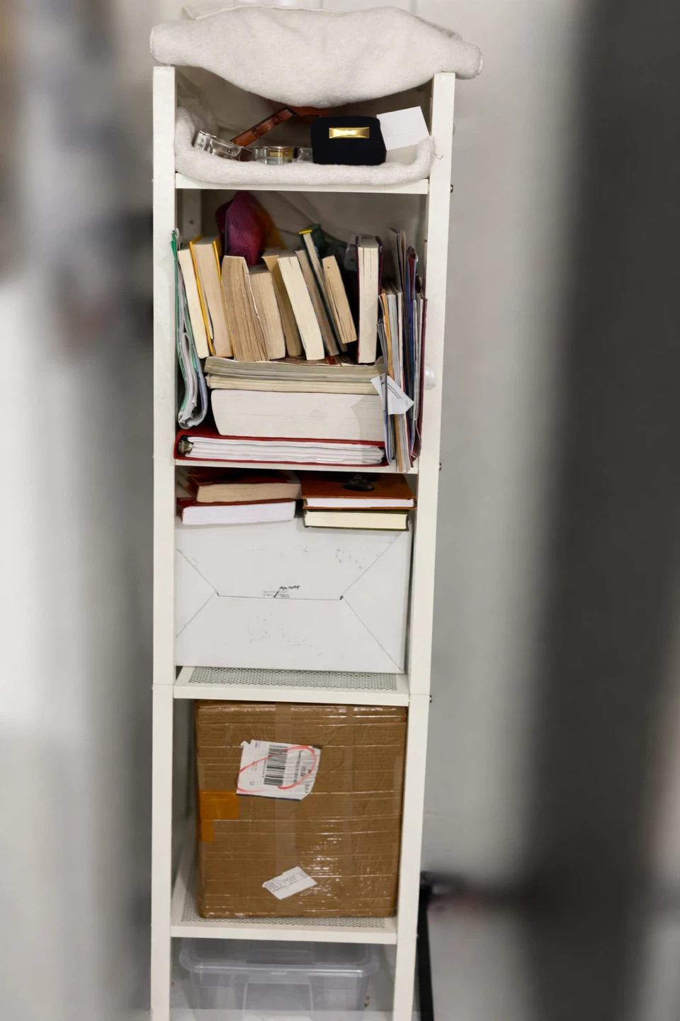 White tall shelving unit