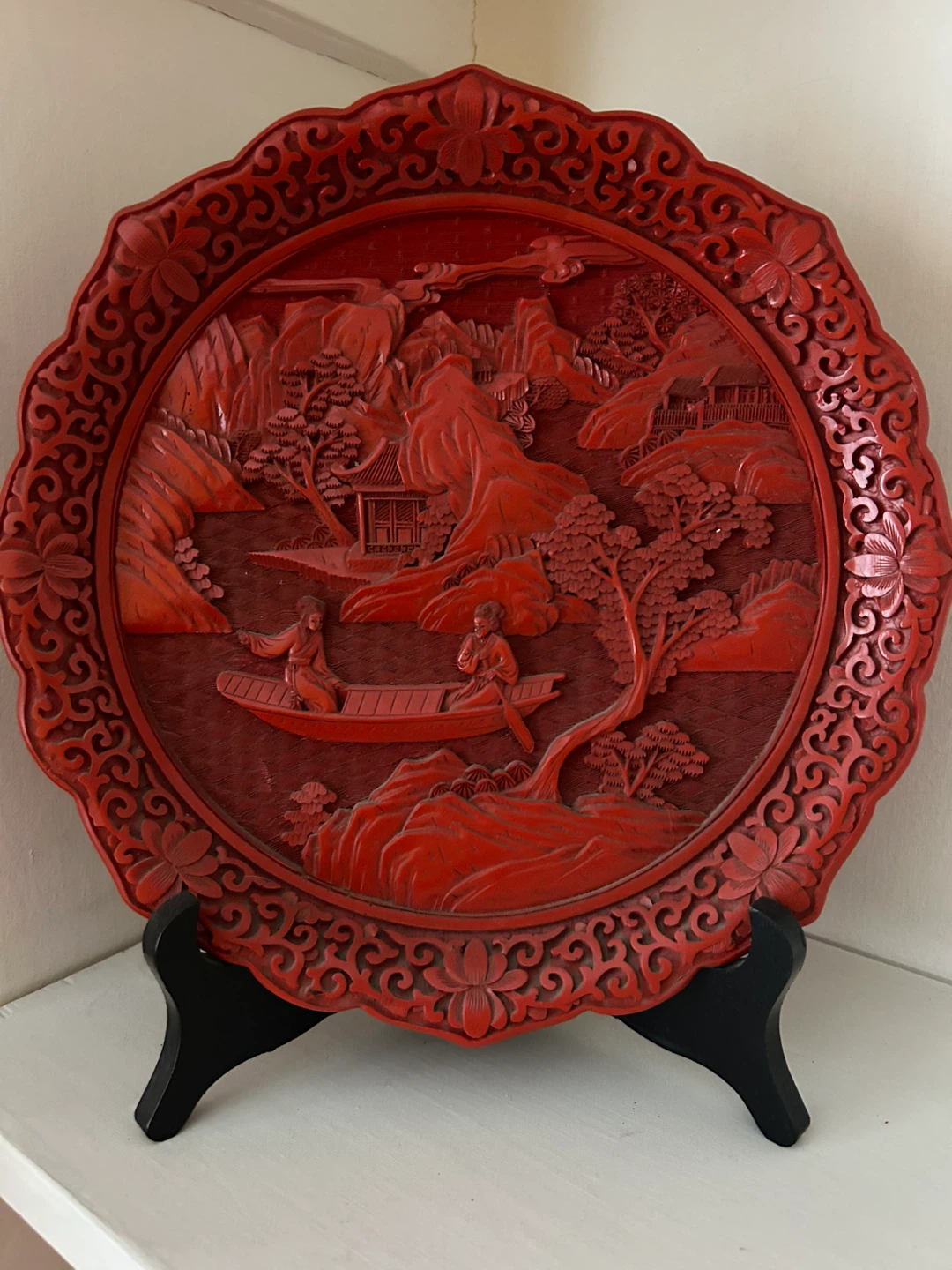 Red carved decorative plate with stand