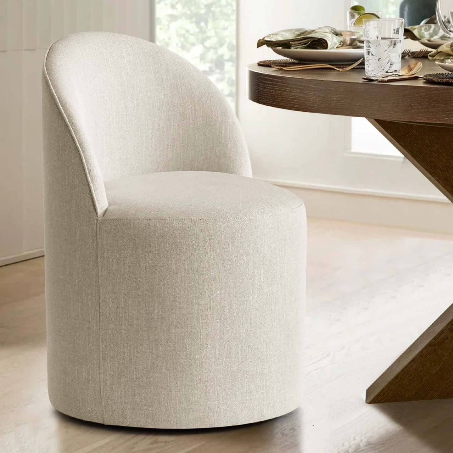 Cream Upholstered Swivel Dining Chair