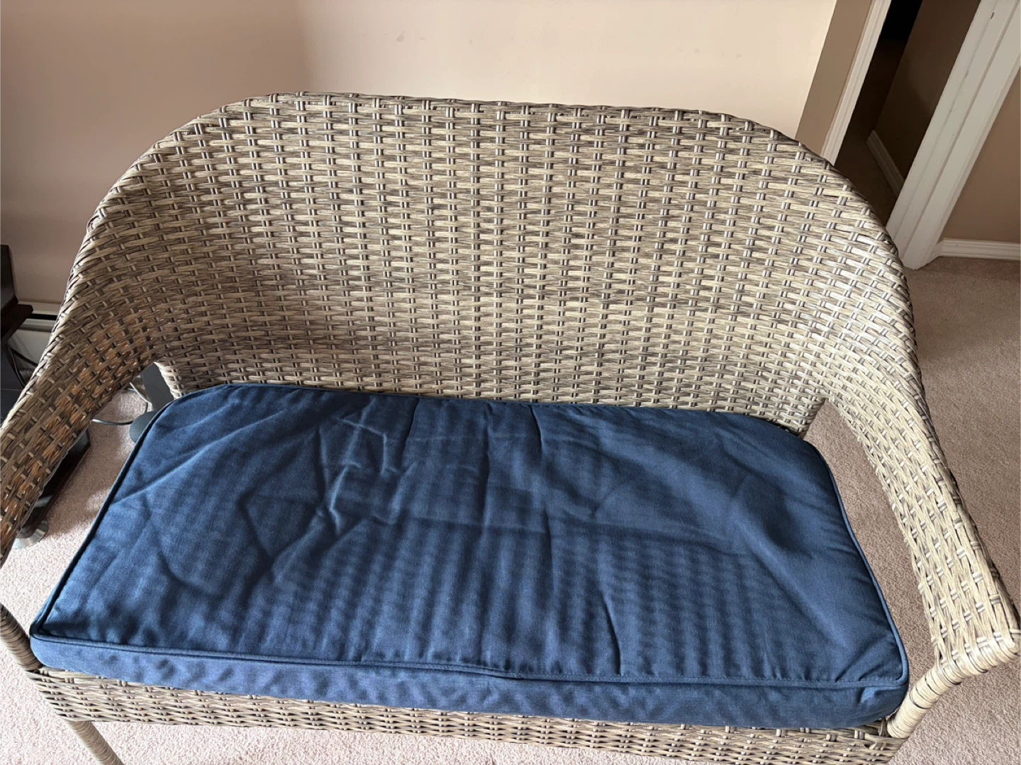 Wicker Loveseat with Navy Blue Cushion