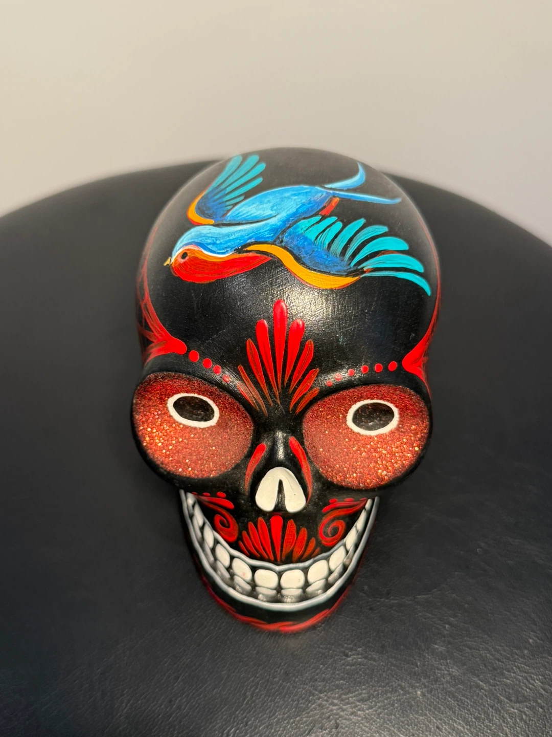 Hand-Painted Decorative Skull Figurine with Bird Design