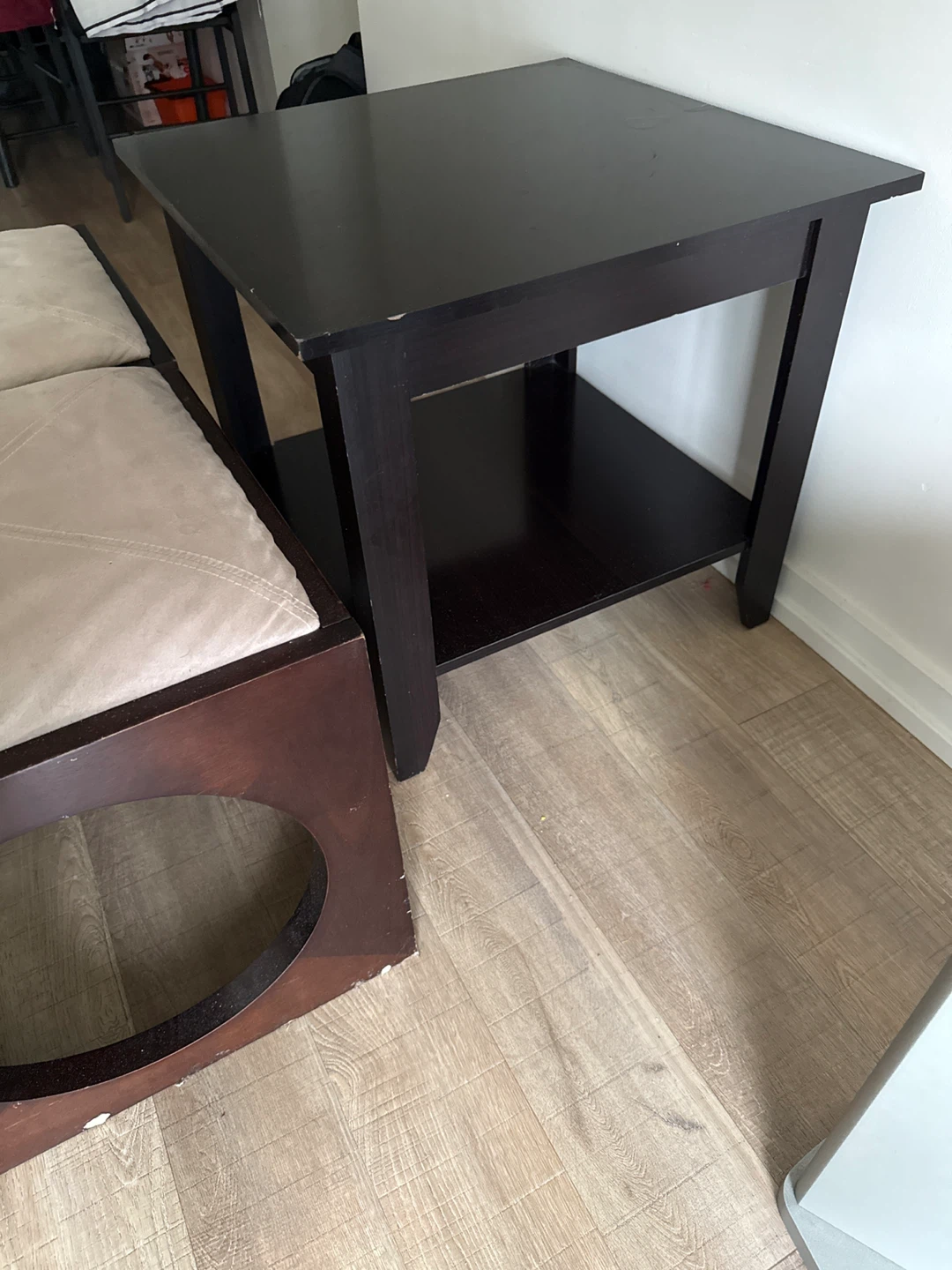 Set of 2 dark brown ottomans with beige fabric seats and a Table