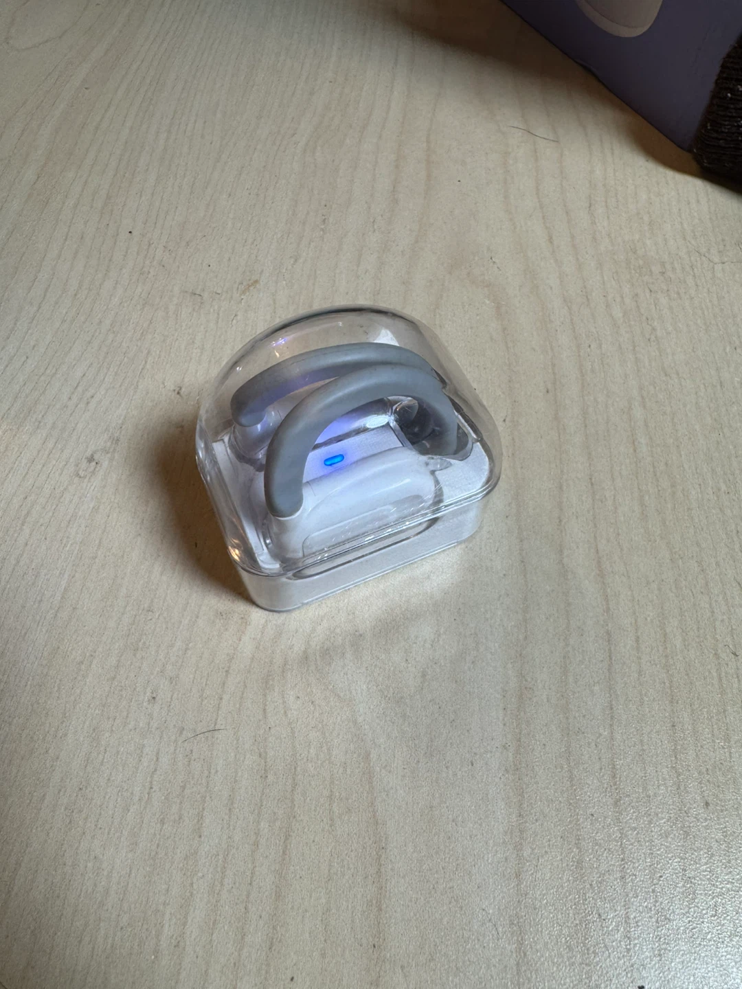 White Wireless Earbuds with Gray Ear Hooks