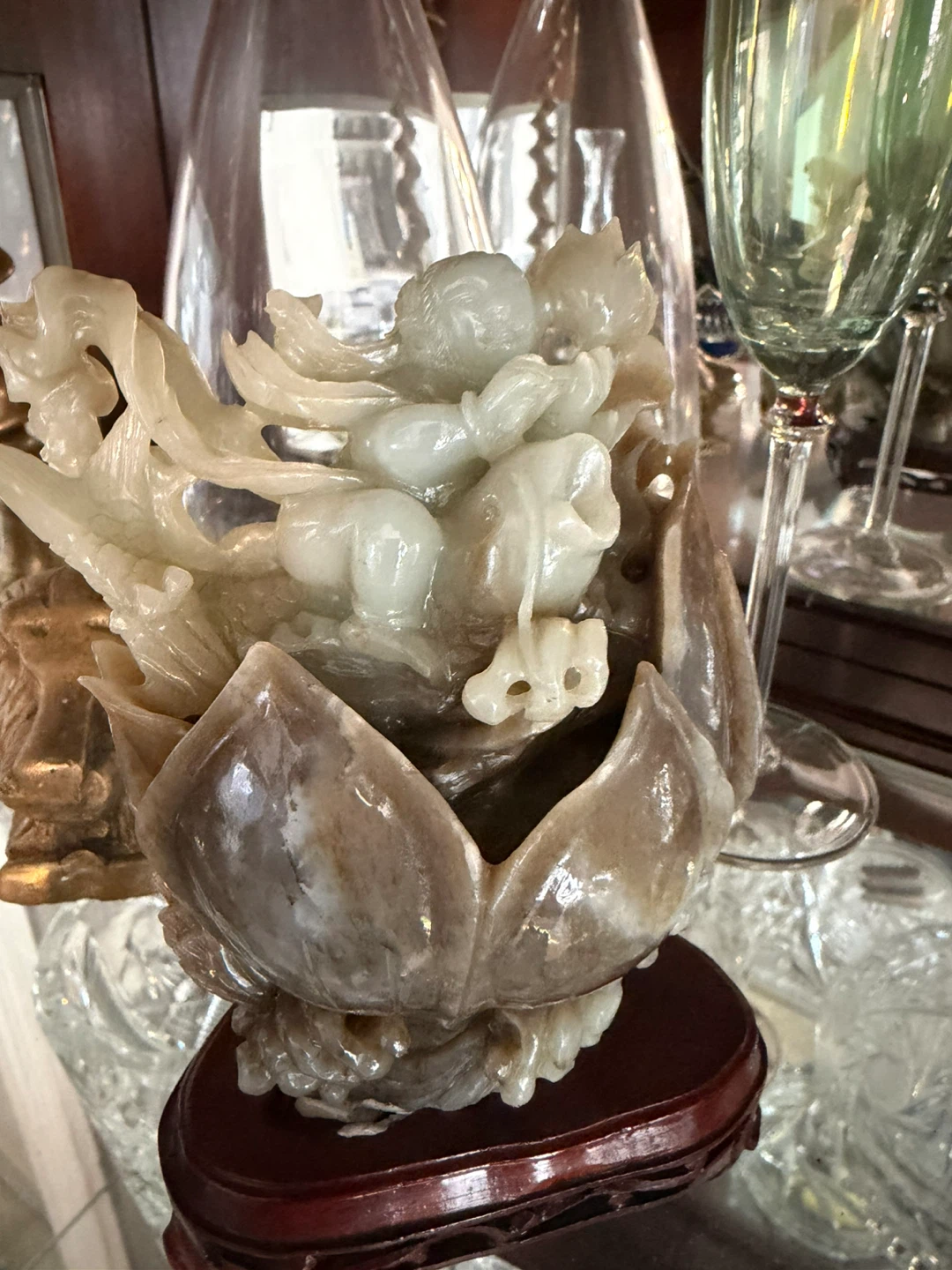 Carved Stone Figurine with Lotus Base