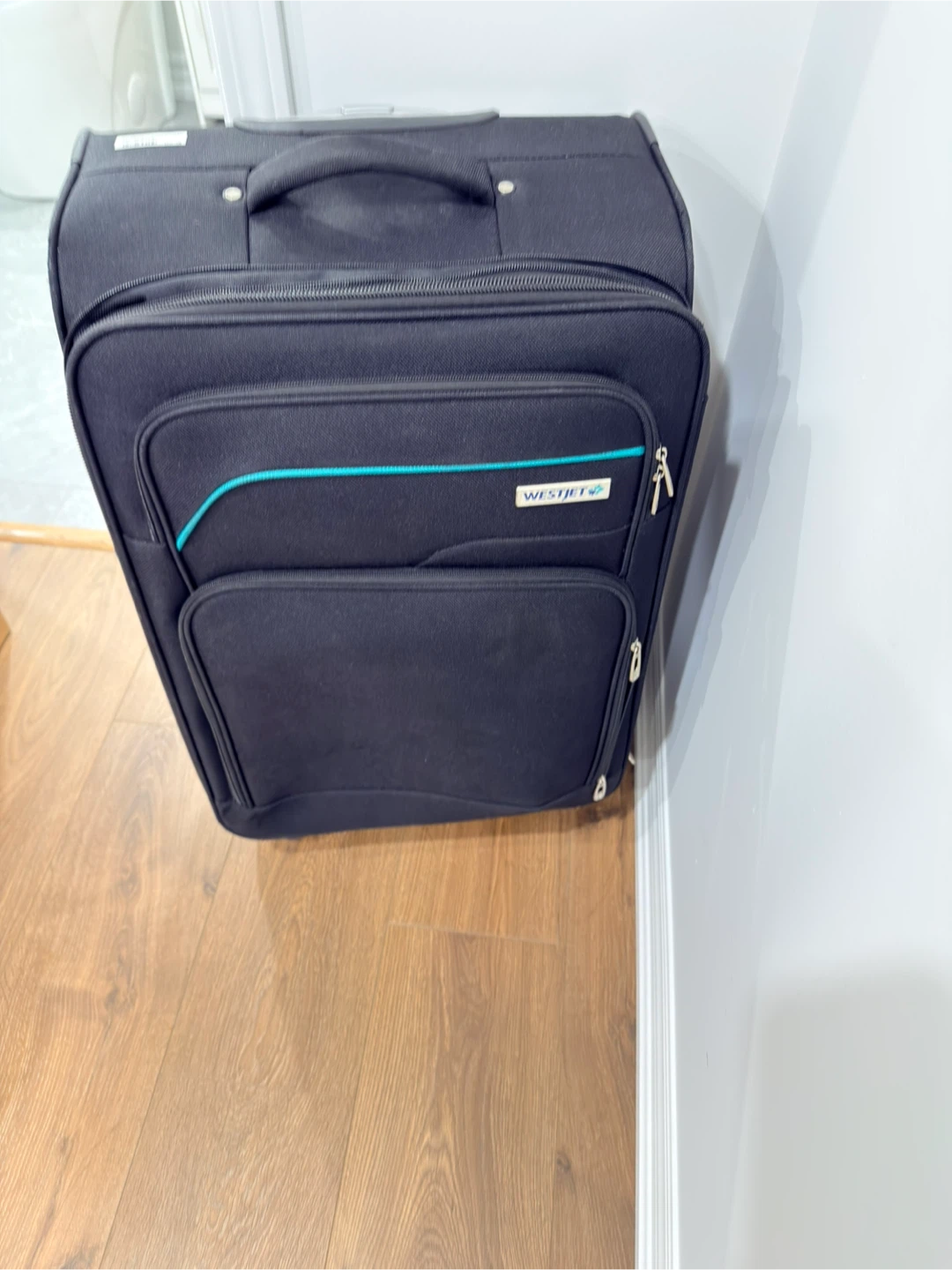 WestJet Black Rolling Suitcase