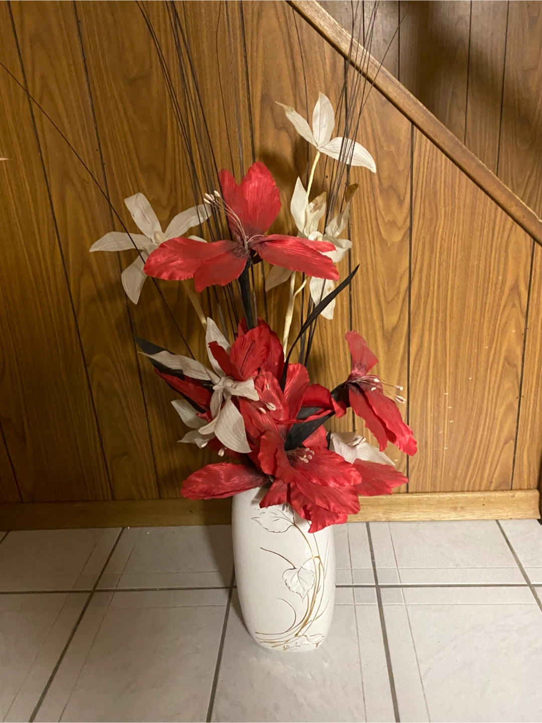 Decorative floral arrangement with white vase