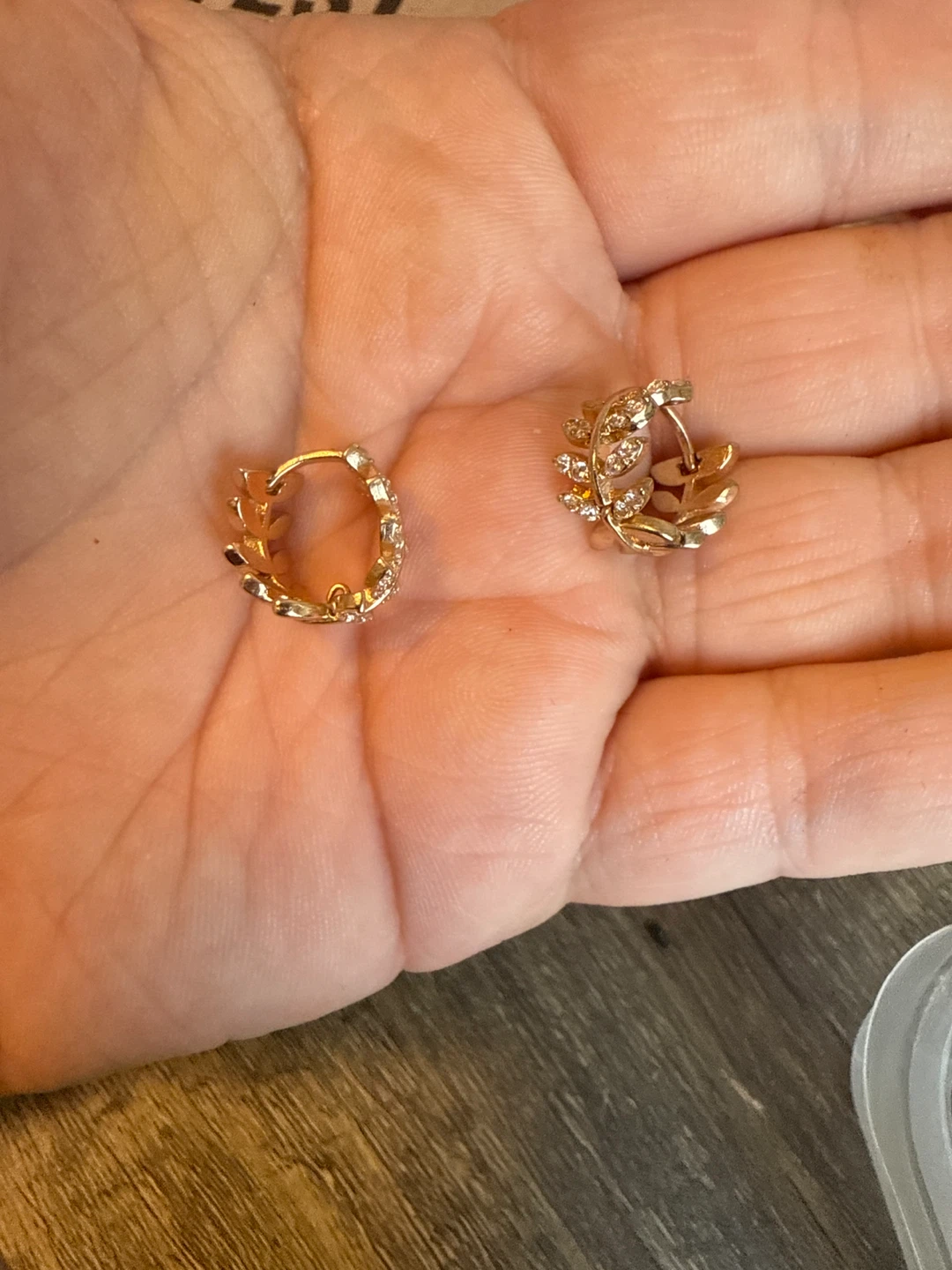 Gold Tone Leaf Hoop Earrings with Clear Stones