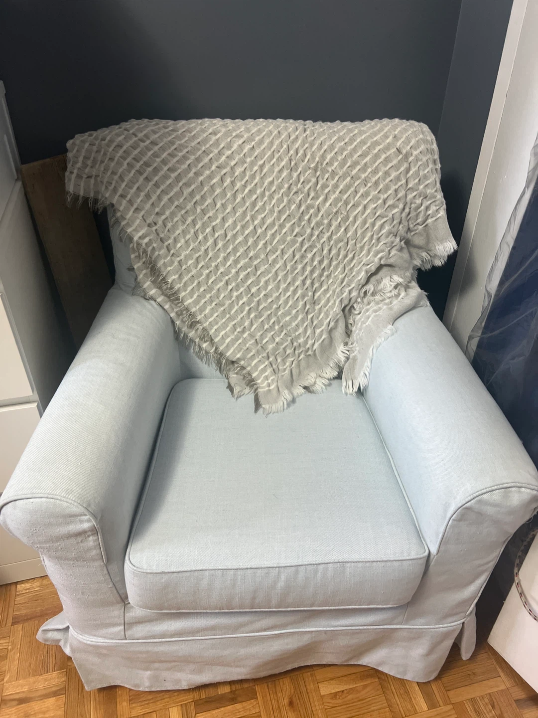 Light Blue Armchair with Waffle Knit Throw
