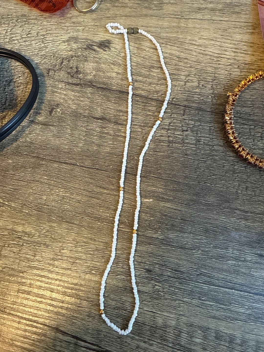 White Beaded Necklace with Gold Accents
