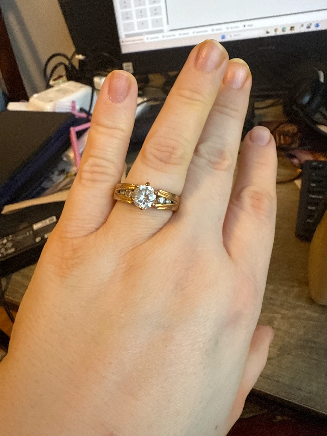 Gold-tone ring with clear stones
