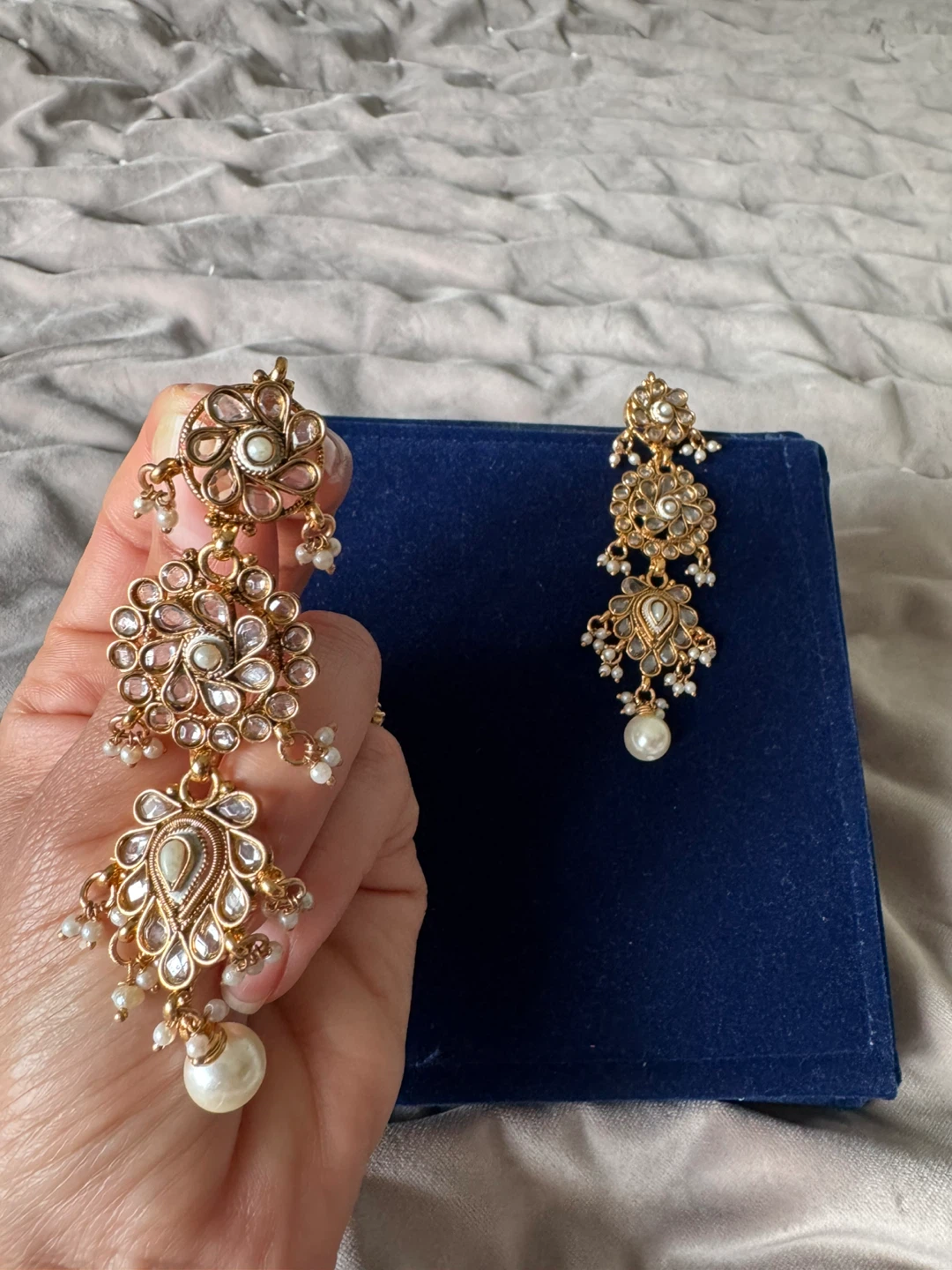 Gold coloured statement drop earrings with pearl details