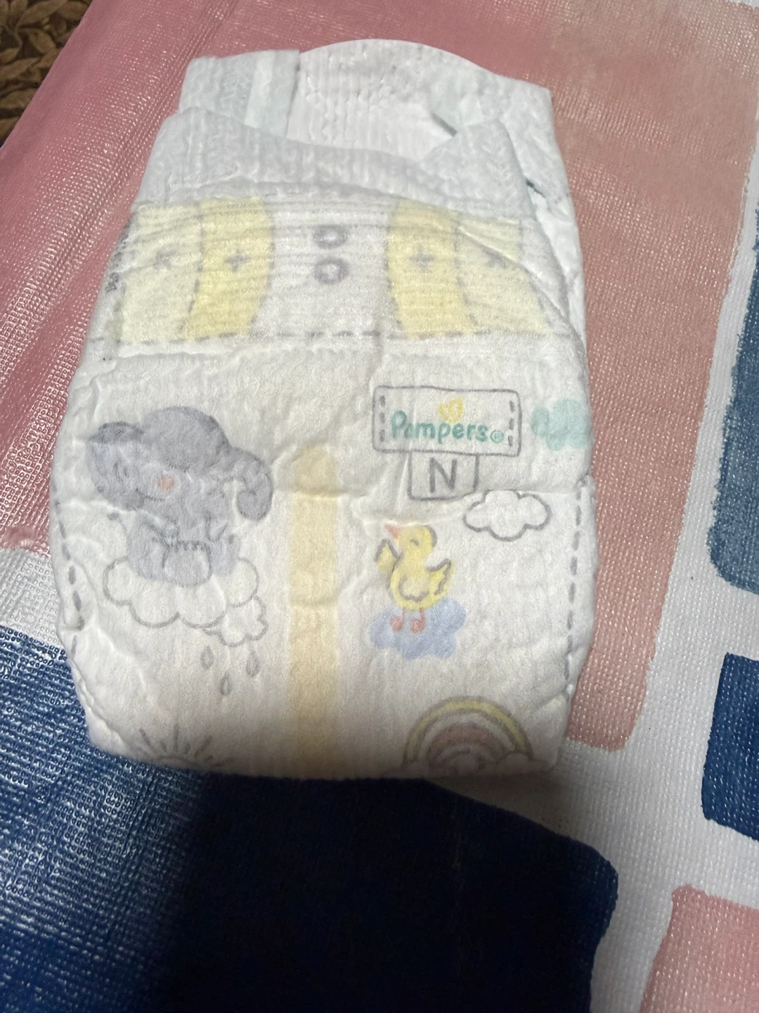 62 pieces of Pampers N Diapers