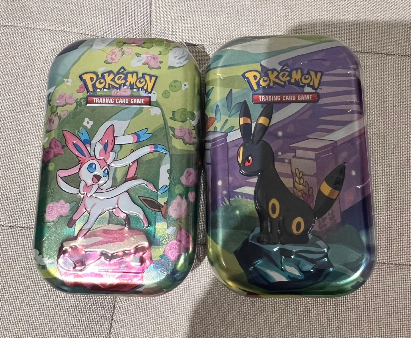 Prismatic Evolution Tins
