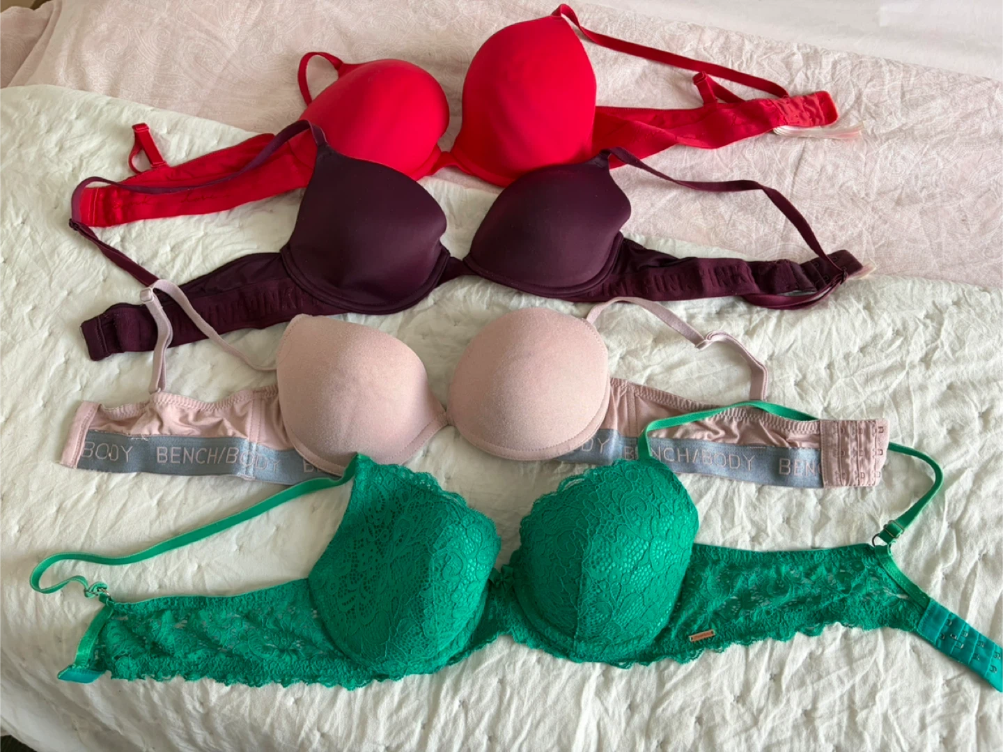 Four Bras: Red, Burgundy, Pink, and Green