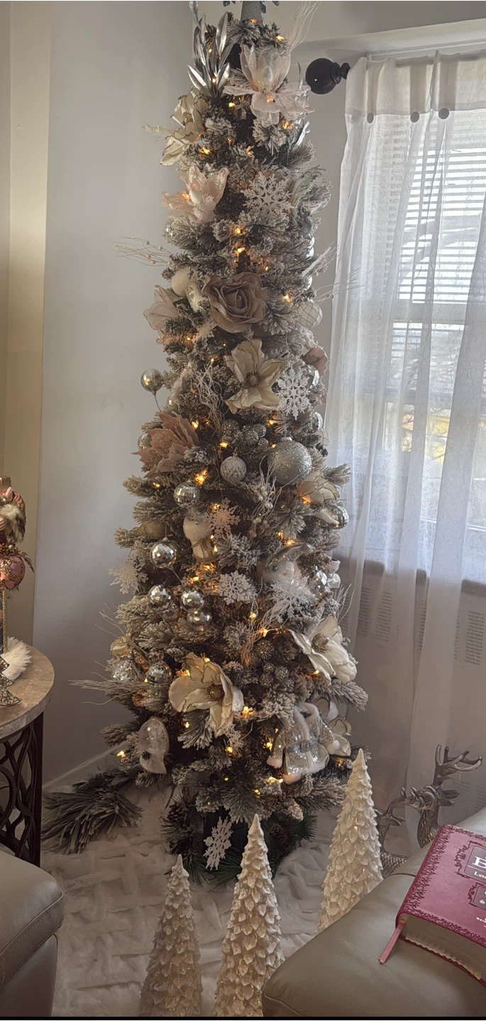 Pre-lit flocked artificial Christmas tree with ornaments
