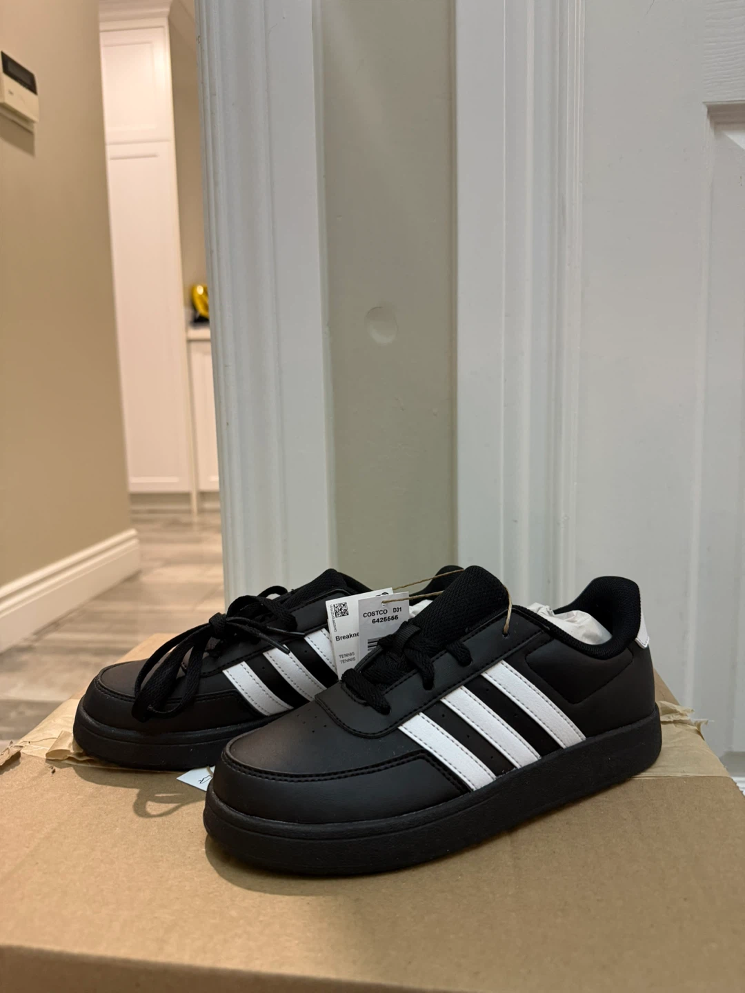 Adidas Black Sneakers with White Stripes