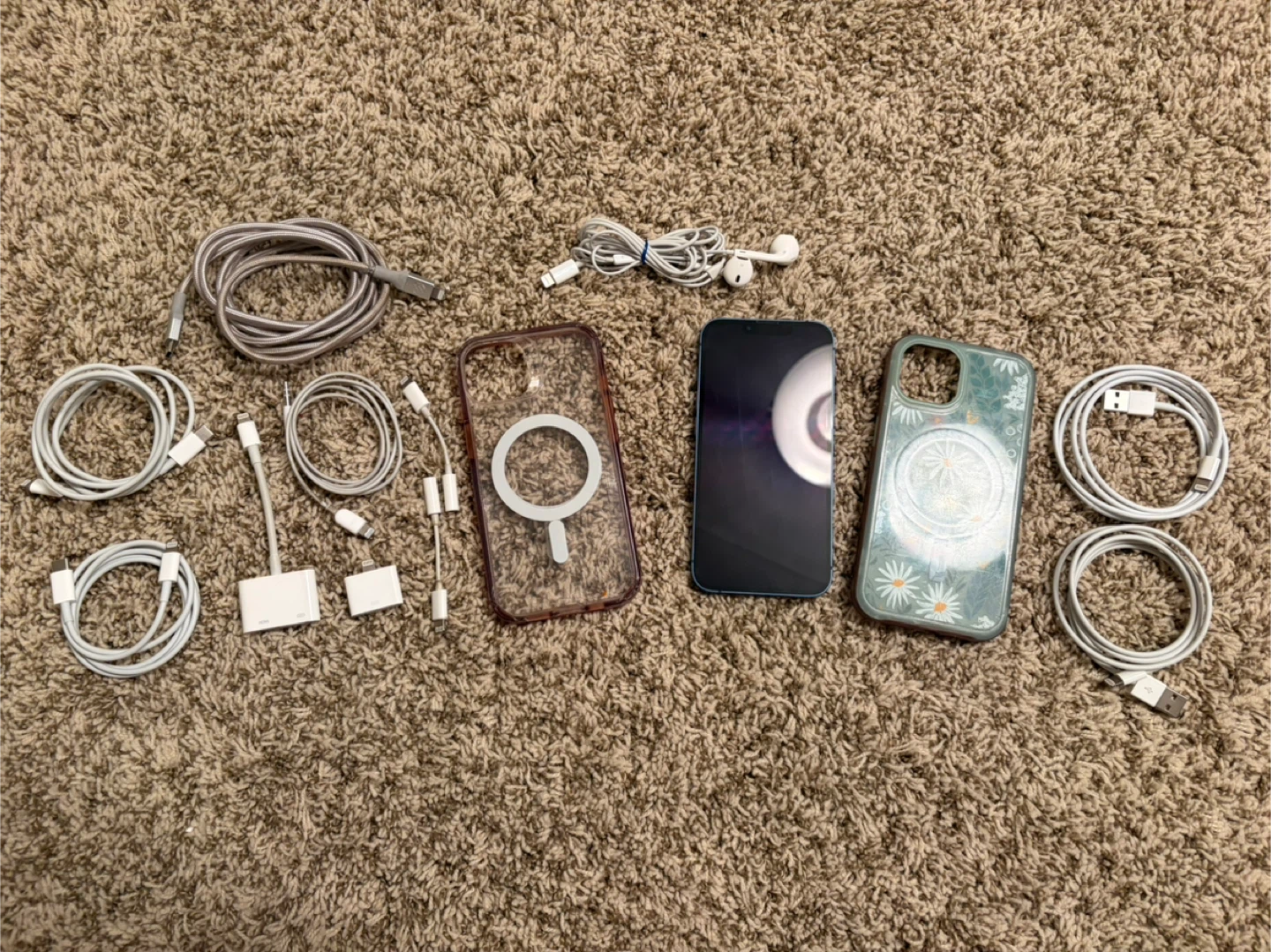 Blue iPhone 13 with accessories