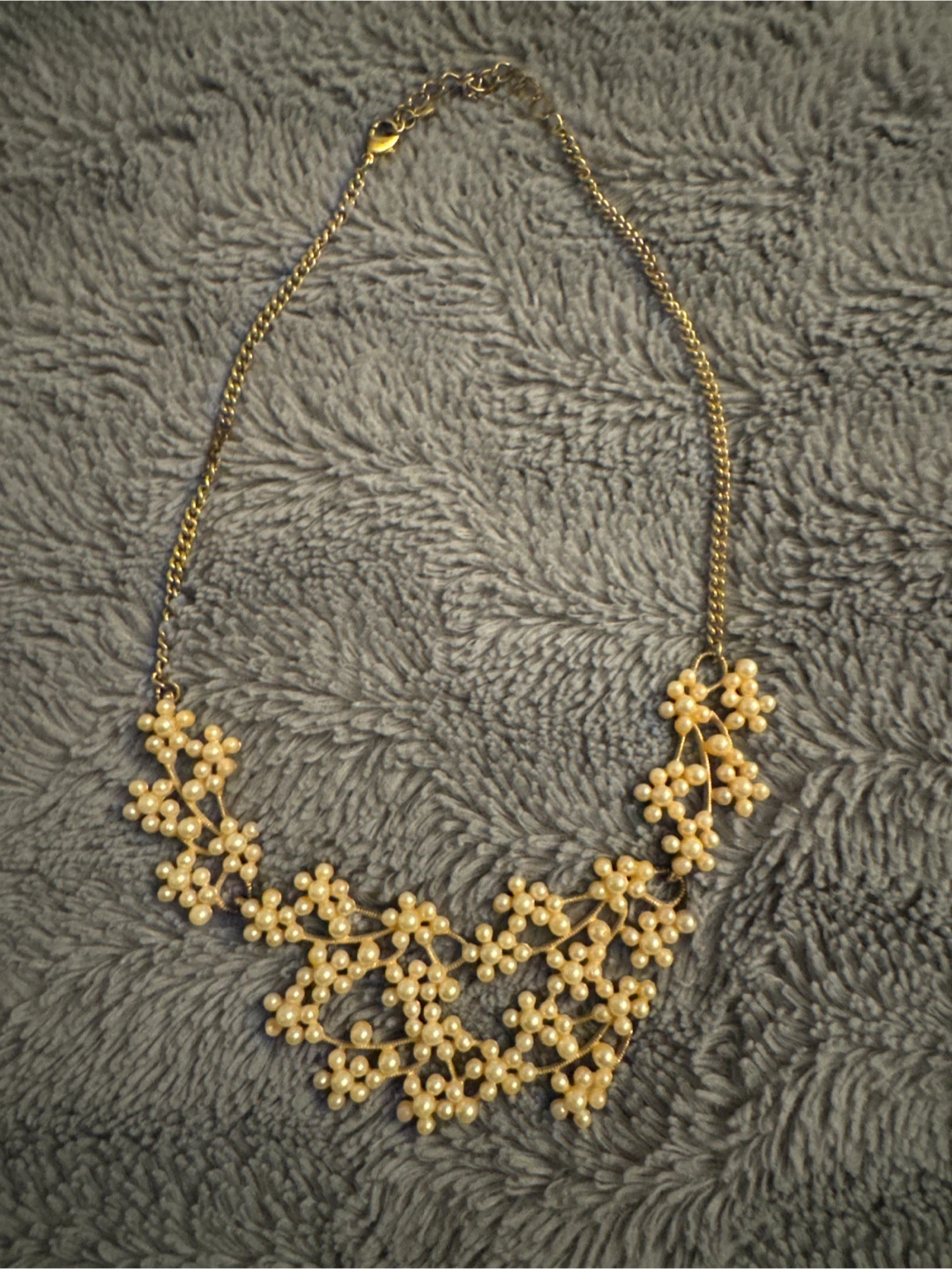 Gold tone faux pearl statement necklace