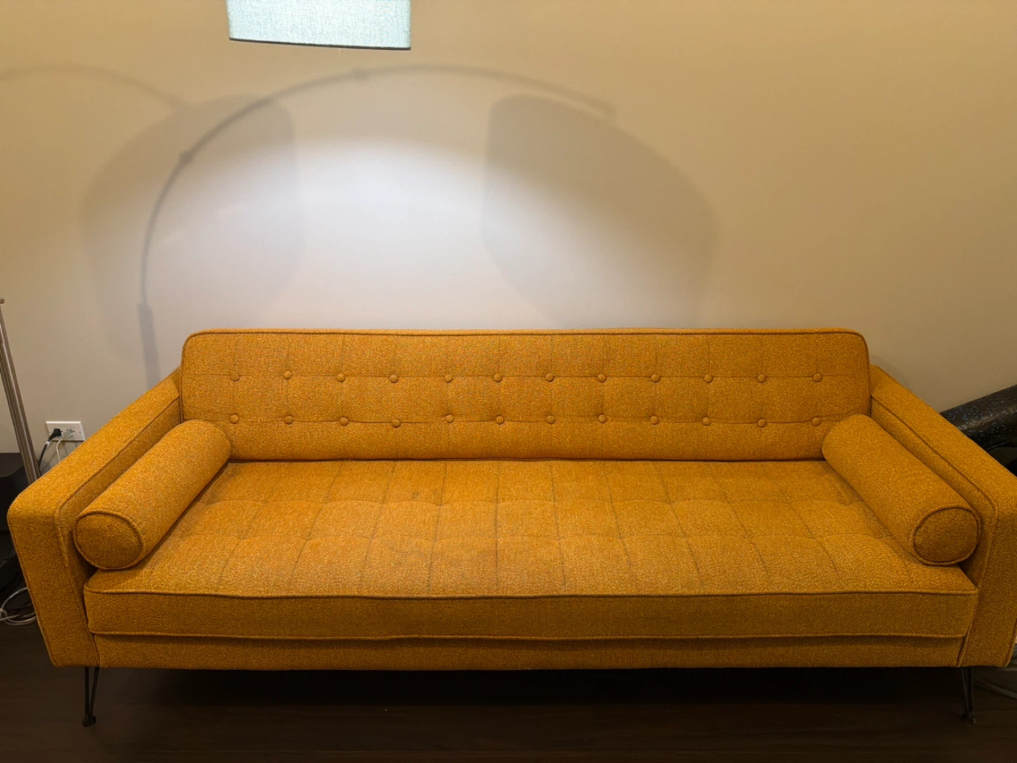 Yellow Tufted Sofa with Bolster Pillows
