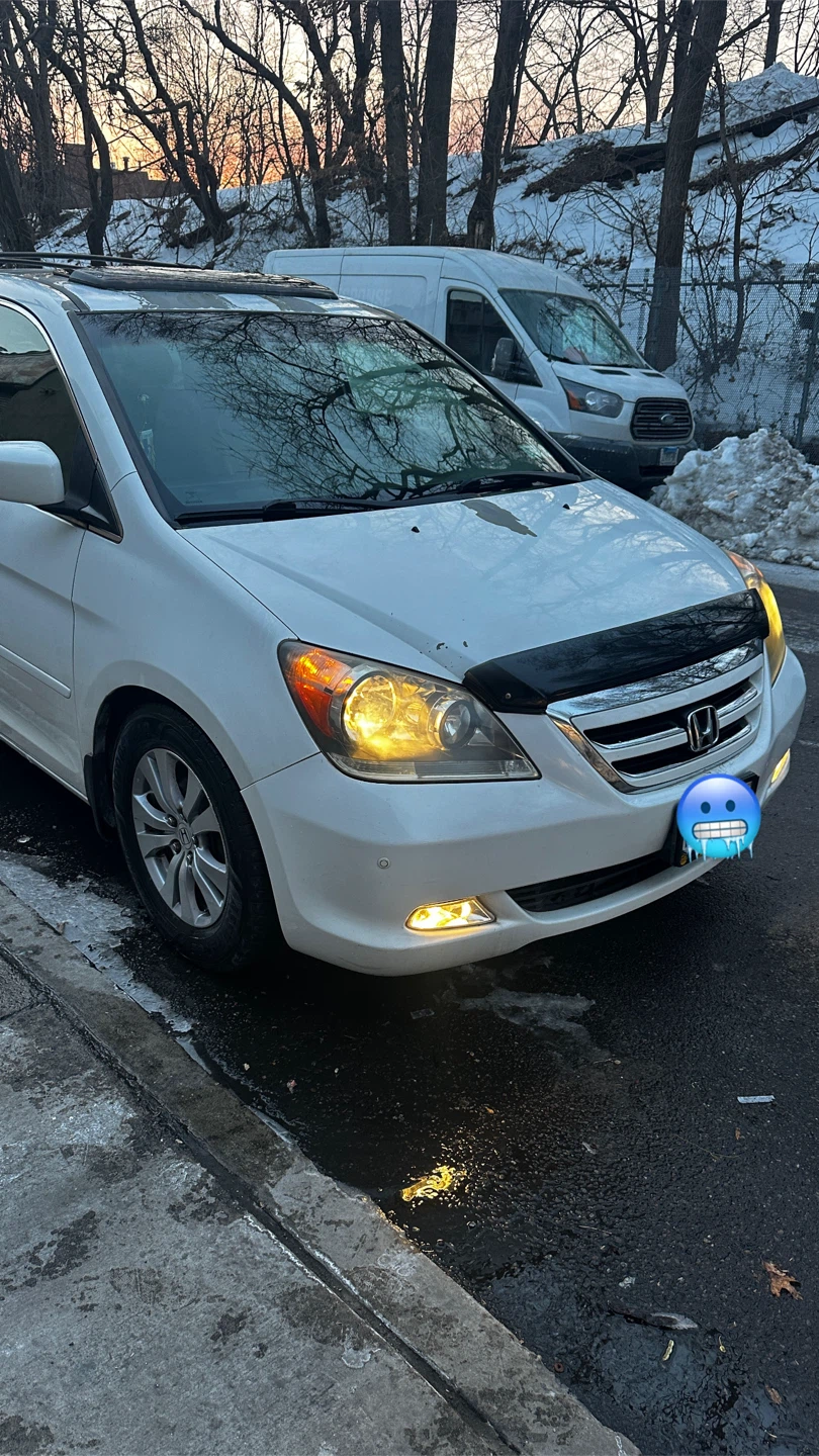 White Honda Odyssey Touring Minivan